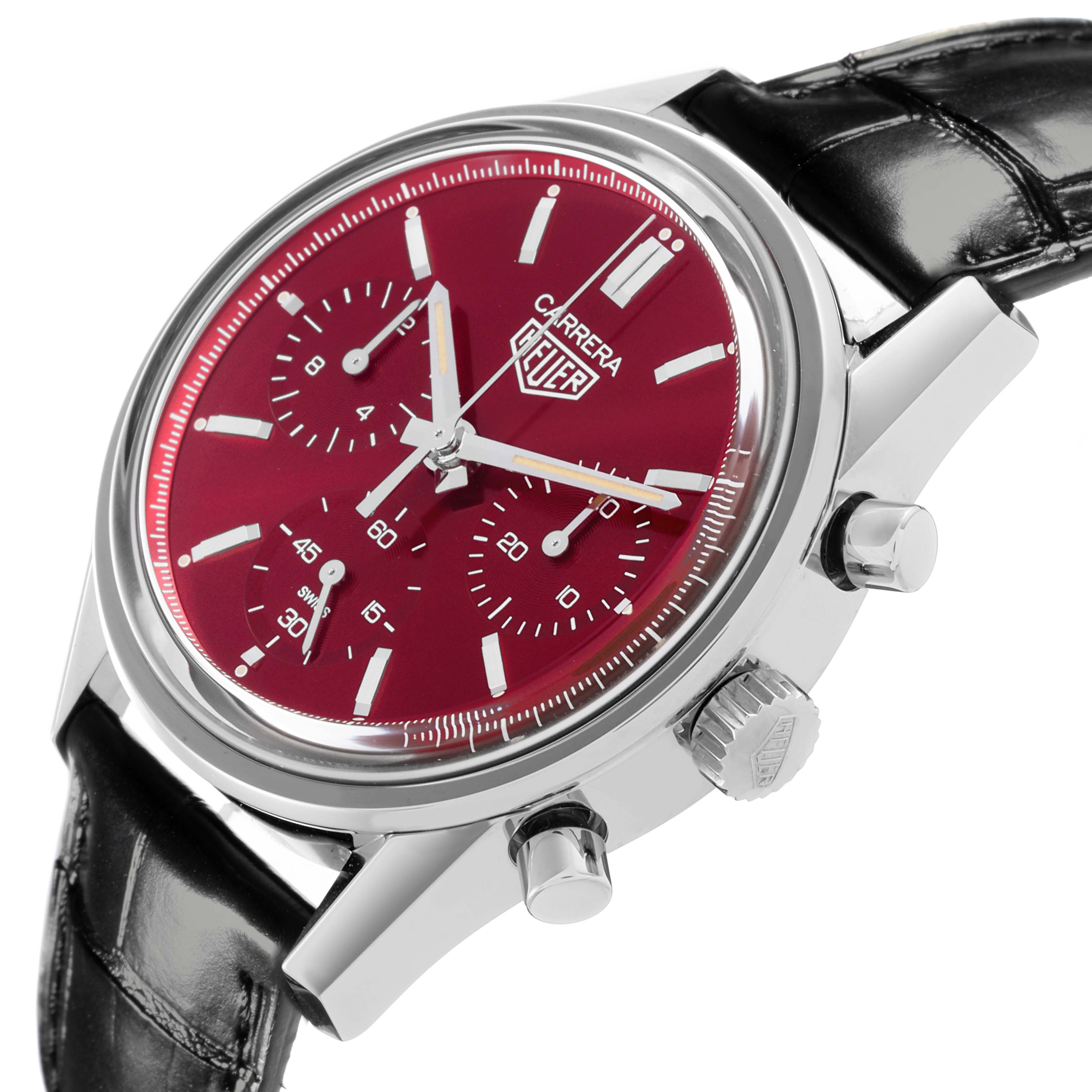 The Tag Heuer Carrera CBK221G.FC6479 Men's Stainless Steel Red Dial CBK221G.FC6479 Men's Stainless Steel Red Dial watch is shown at a slight angle, highlighting the red dial, three subdials, crown, and pushers.