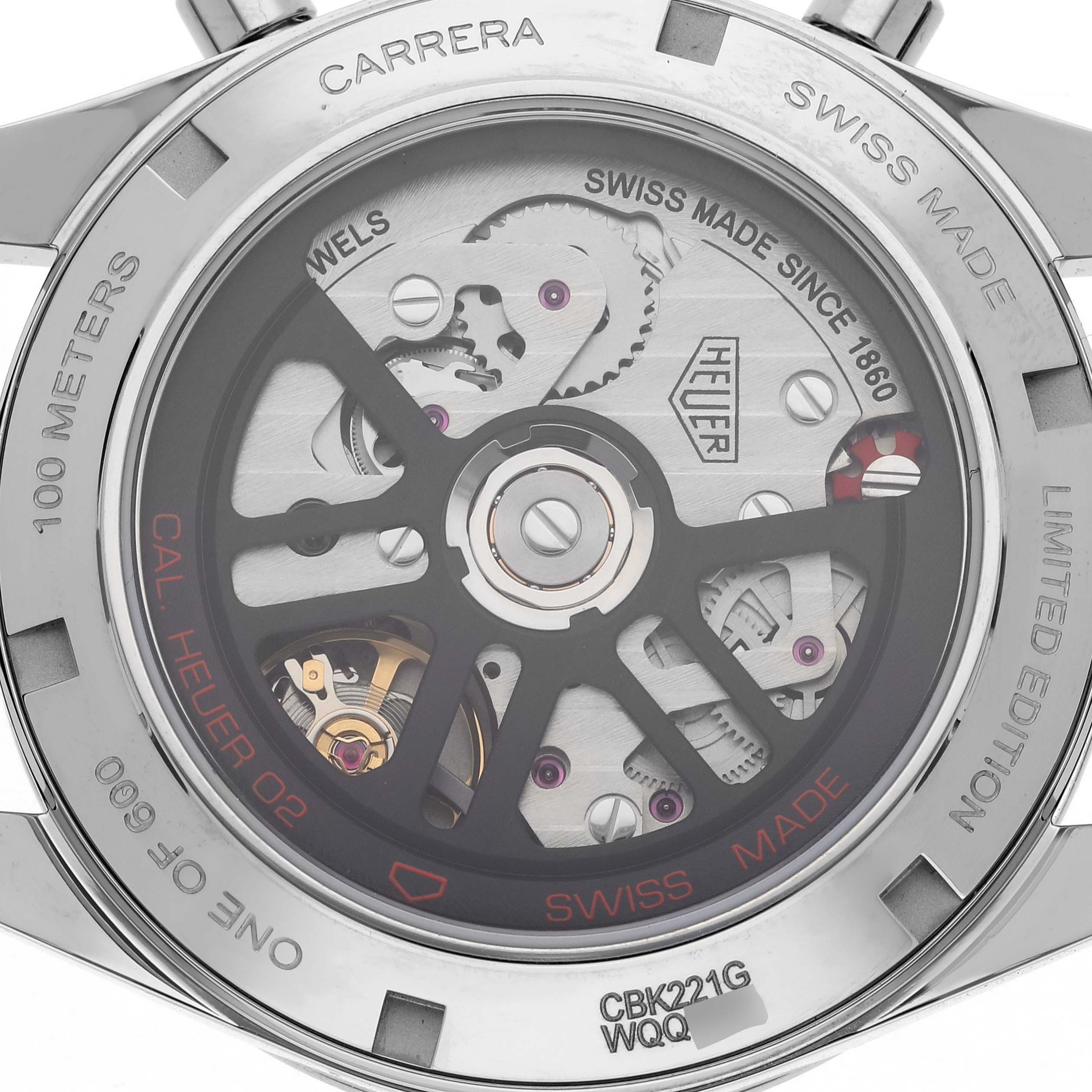 The image shows the back of a Tag Heuer Carrera CBK221G.FC6479 Men's Stainless Steel Red Dial CBK221G.FC6479 Men's Stainless Steel Red Dial watch, displaying the intricate movement and branding details.