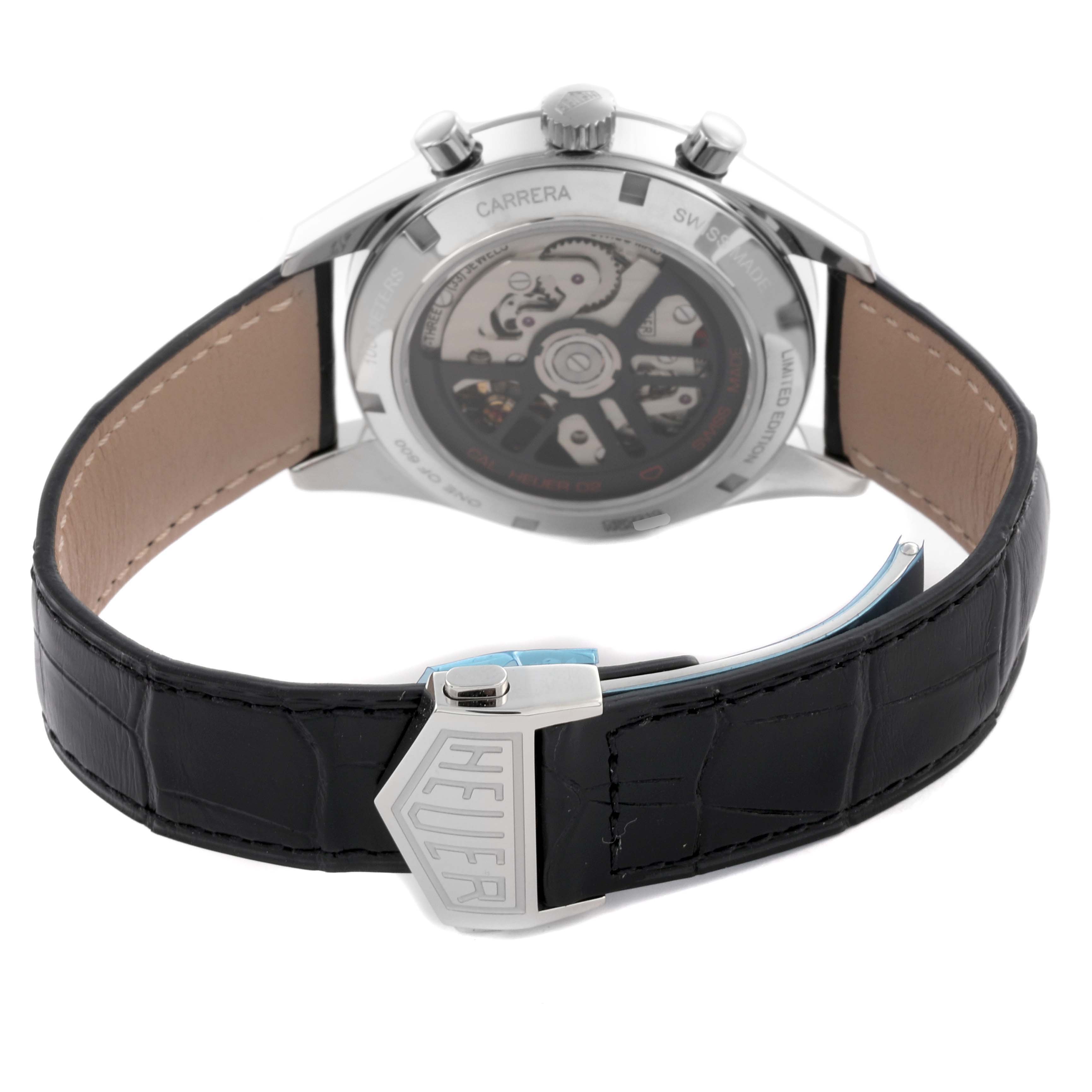 The image shows the back view of a Tag Heuer Carrera CBK221G.FC6479 Men's Stainless Steel Red Dial CBK221G.FC6479 Men's Stainless Steel Red Dial watch, highlighting the leather strap and the clasp with "HEUER" branding.