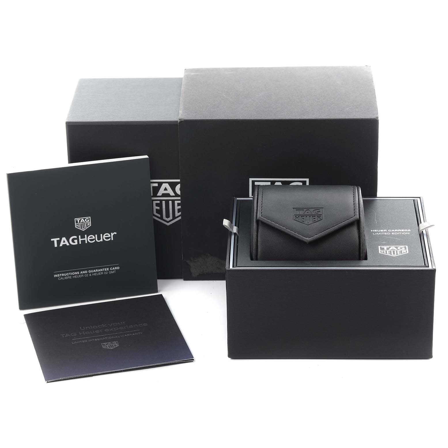The image shows the packaging and accessories for a Tag Heuer Carrera CBK221G.FC6479 Men's Stainless Steel Red Dial CBK221G.FC6479 Men's Stainless Steel Red Dial watch, including boxes and manuals from a frontal angle.