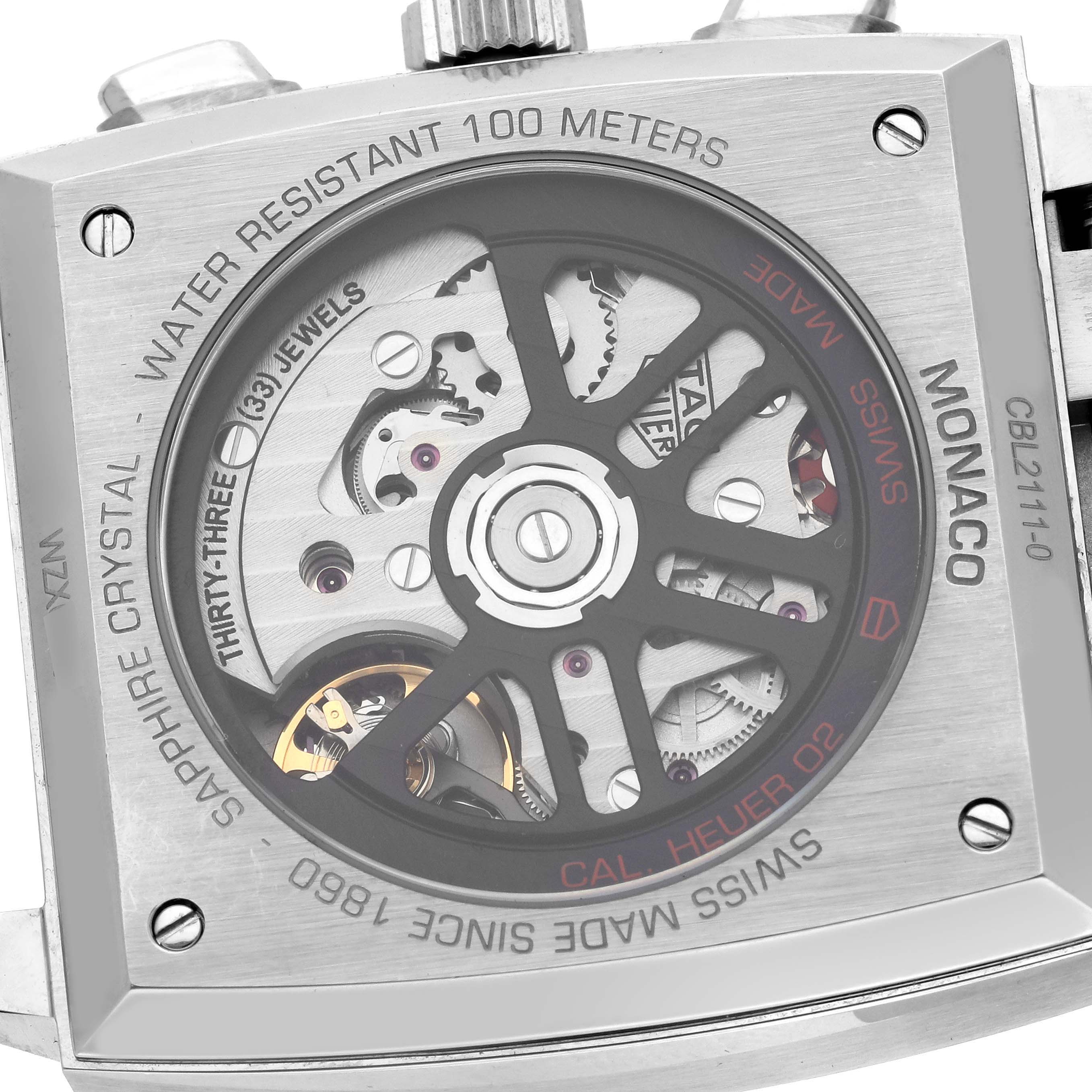 The image shows the case back of a Tag Heuer Monaco CBL2111.BA0644 Men's Stainless Steel Blue Dial CBL2111.BA0644 Men's Stainless Steel Blue Dial model, highlighting the movement and rotor details.