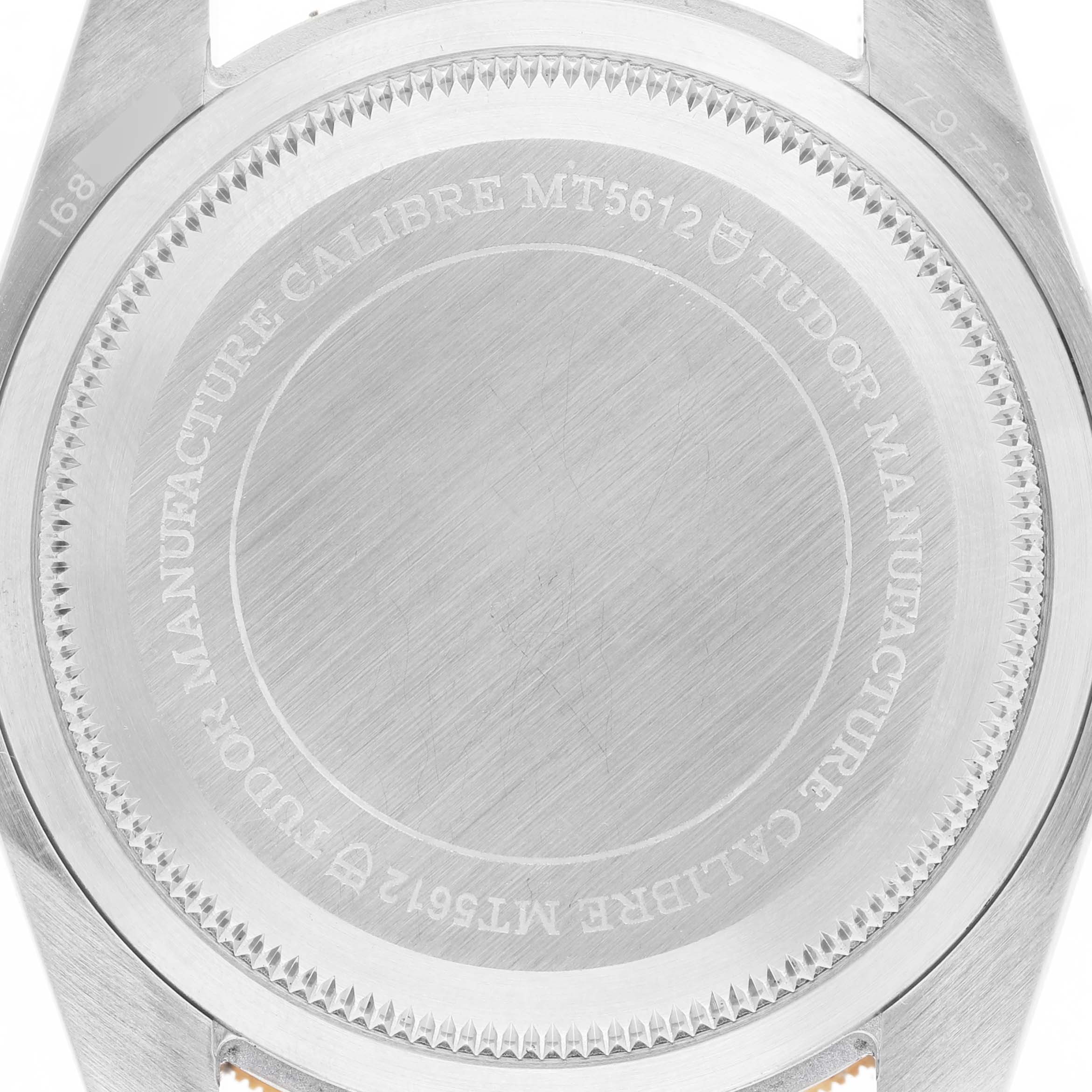 The image shows the back of the Tudor Heritage Black Bay 79733N Men's Steel and Gold (two tone) Black Dial watch, highlighting the engravings on the case back.