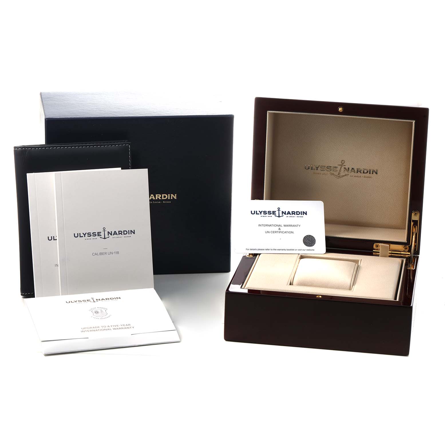 The Ulysse Nardin Diver 1185-170 Men's Titanium Black Dial watch accessories include an open presentation box, warranty card, and manuals, viewed from the front.