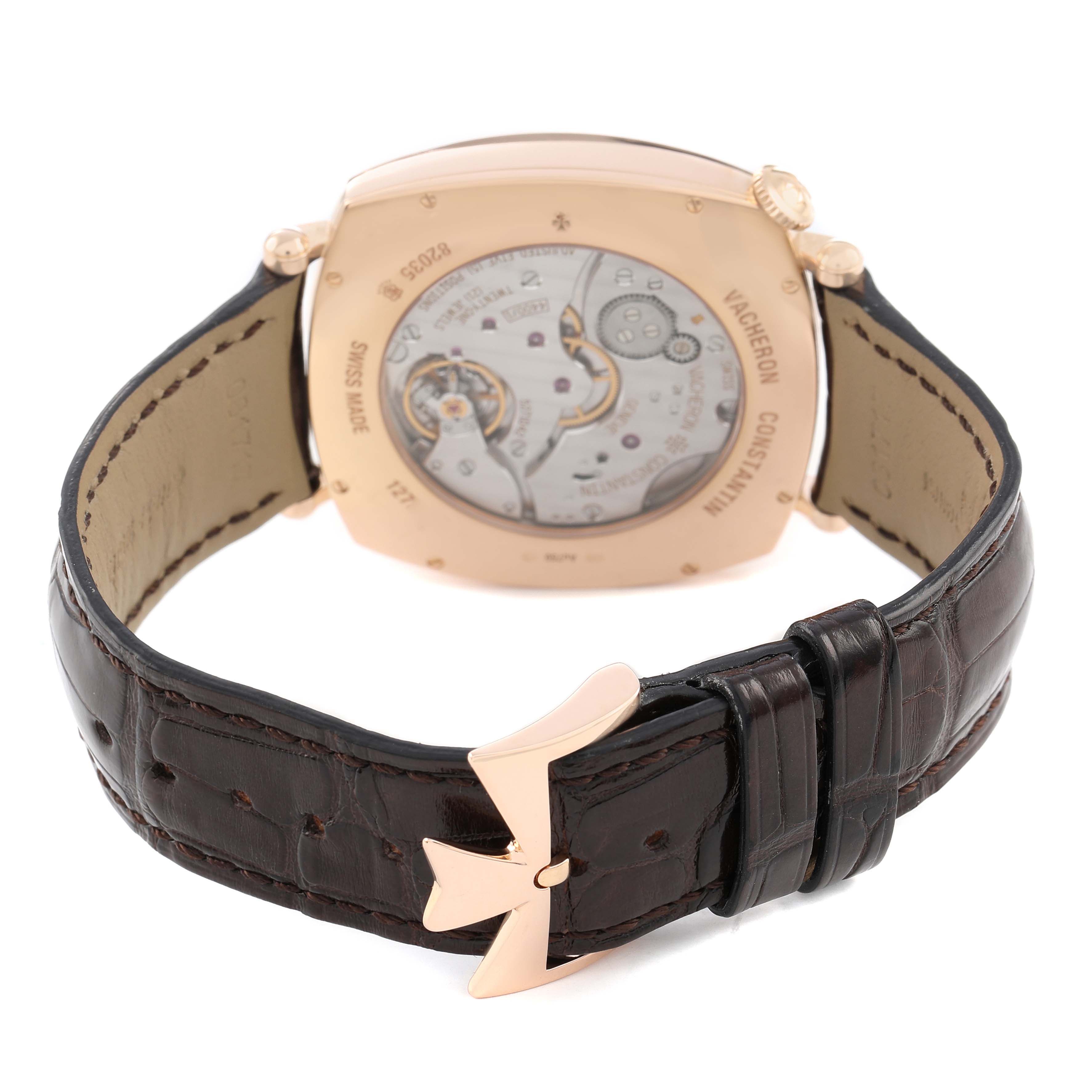 The image shows the back of a Vacheron Constantin Historiques 82035 Men's Rose Gold Silver Dial watch, highlighting the movement and alligator leather strap with a distinctive buckle.