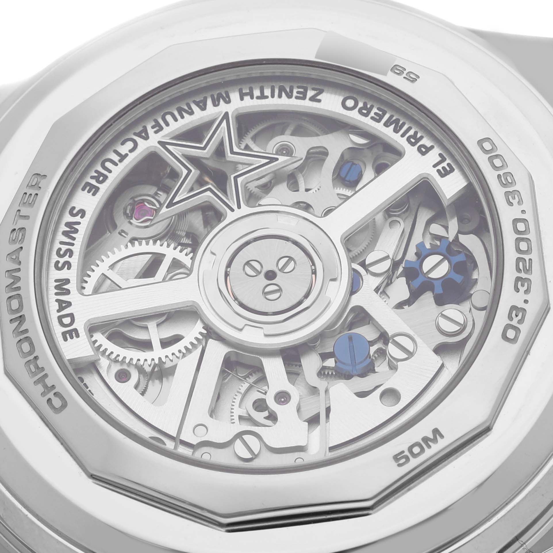 The image shows the back view of the Zenith Chronomaster 03.3200.3600/69C902 Men's Stainless Steel White Dial 03.3200.3600/69C902 Men's Stainless Steel White Dial watch, highlighting its mechanical movement and intricate gears.