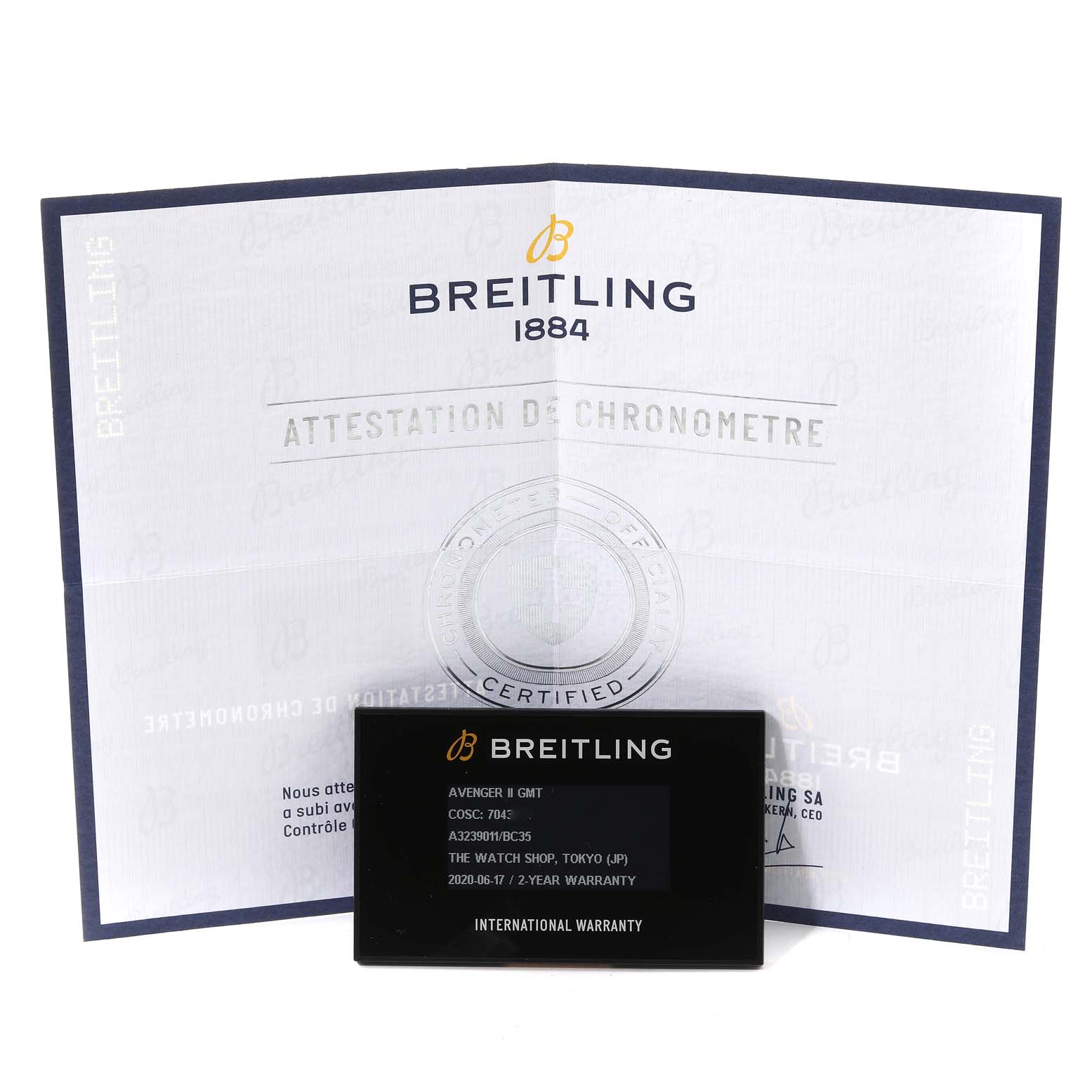 The image shows a Breitling Avenger A32390 Men's Stainless Steel Black Dial A32390 Men's Stainless Steel Black Dial watch's warranty card and chronometer certificate document, displayed head-on.