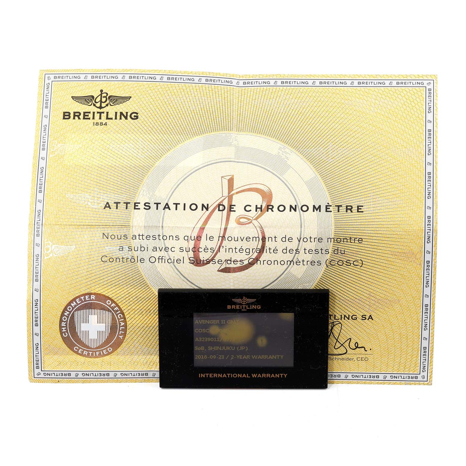 The image shows a Breitling Avenger A32390 Men's Stainless Steel Beige Dial A32390 Men's Stainless Steel Beige Dial model's certificate of authenticity and international warranty card, both viewed from above.