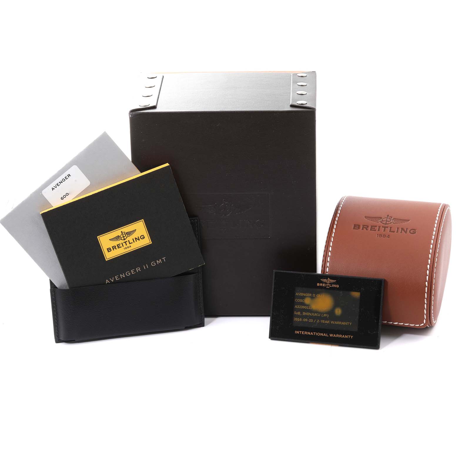 The image shows the packaging, manuals, warranty card, and leather case for the Breitling Avenger A32390 Men's Stainless Steel Beige Dial A32390 Men's Stainless Steel Beige Dial model.