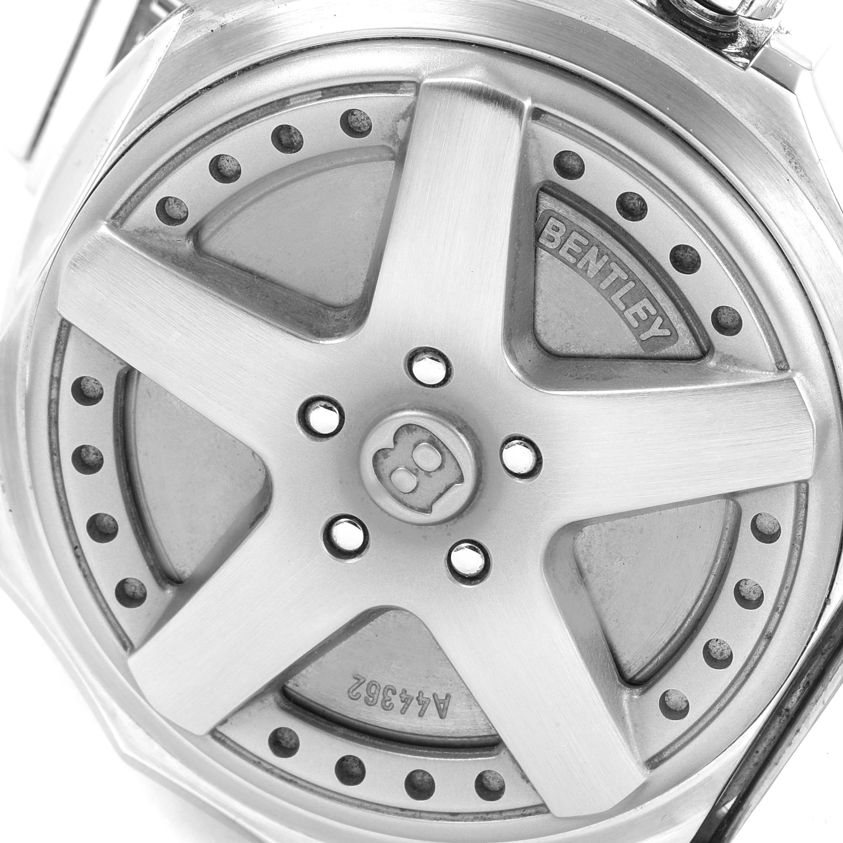 The image shows the caseback of a Breitling Bentley A44362 Men's Stainless Steel Black Dial A44362 Men's Stainless Steel Black Dial watch, featuring a wheel rim design with the Bentley logo.