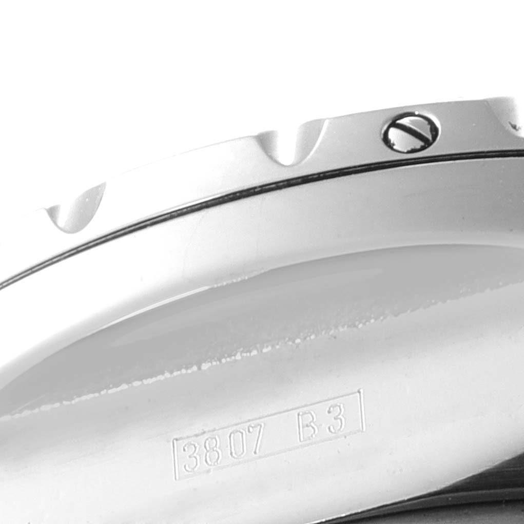 The image shows a close-up angle of the side casing of the Bentley model watch by Breitling, highlighting part of the bezel and serial number.