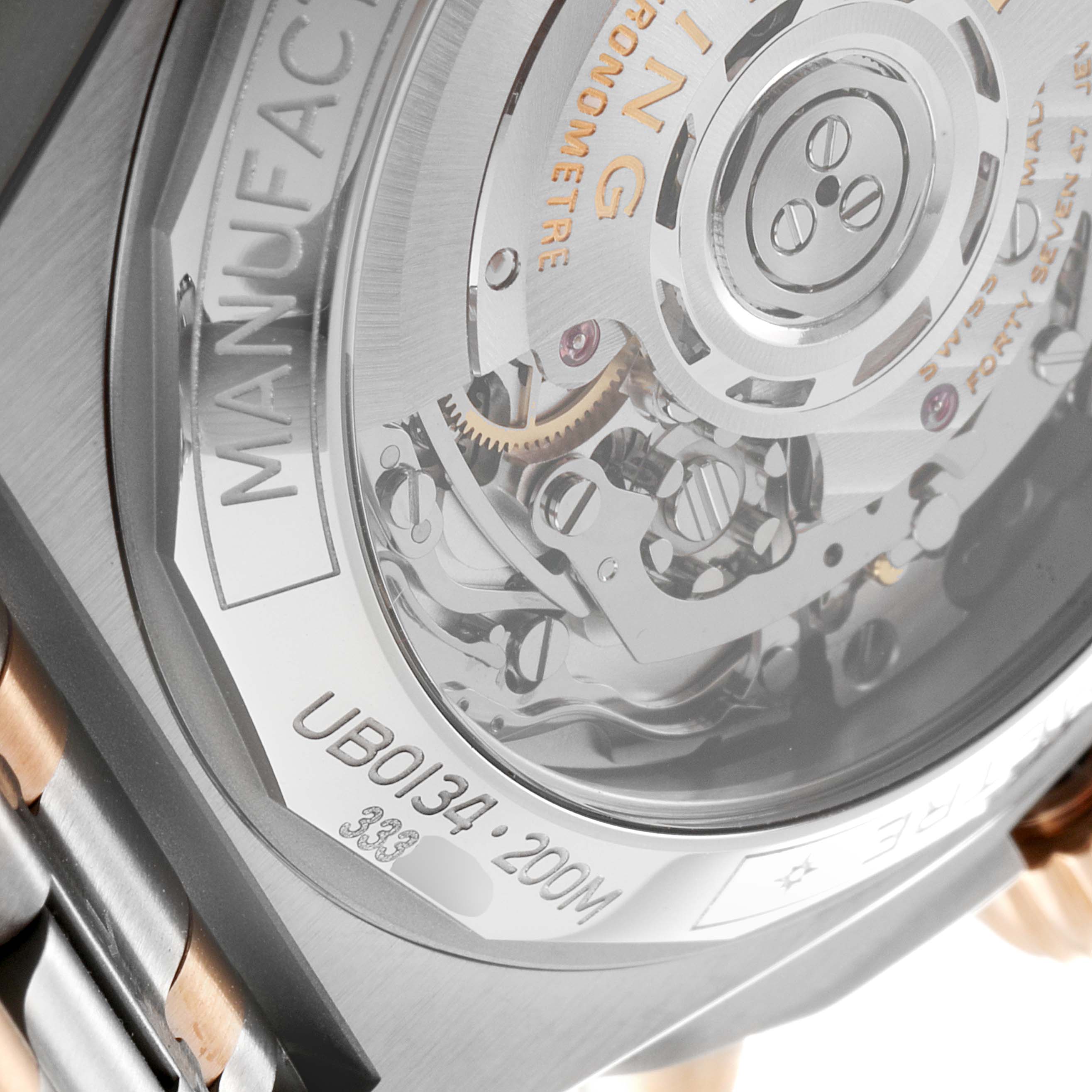 This image shows the movement and case back of the Breitling Chronomat UB0134101C1U1 Men's Steel and Gold (two tone) Grey Dial UB0134101C1U1 Men's Steel and Gold (two tone) Grey Dial watch at a close-up angle.