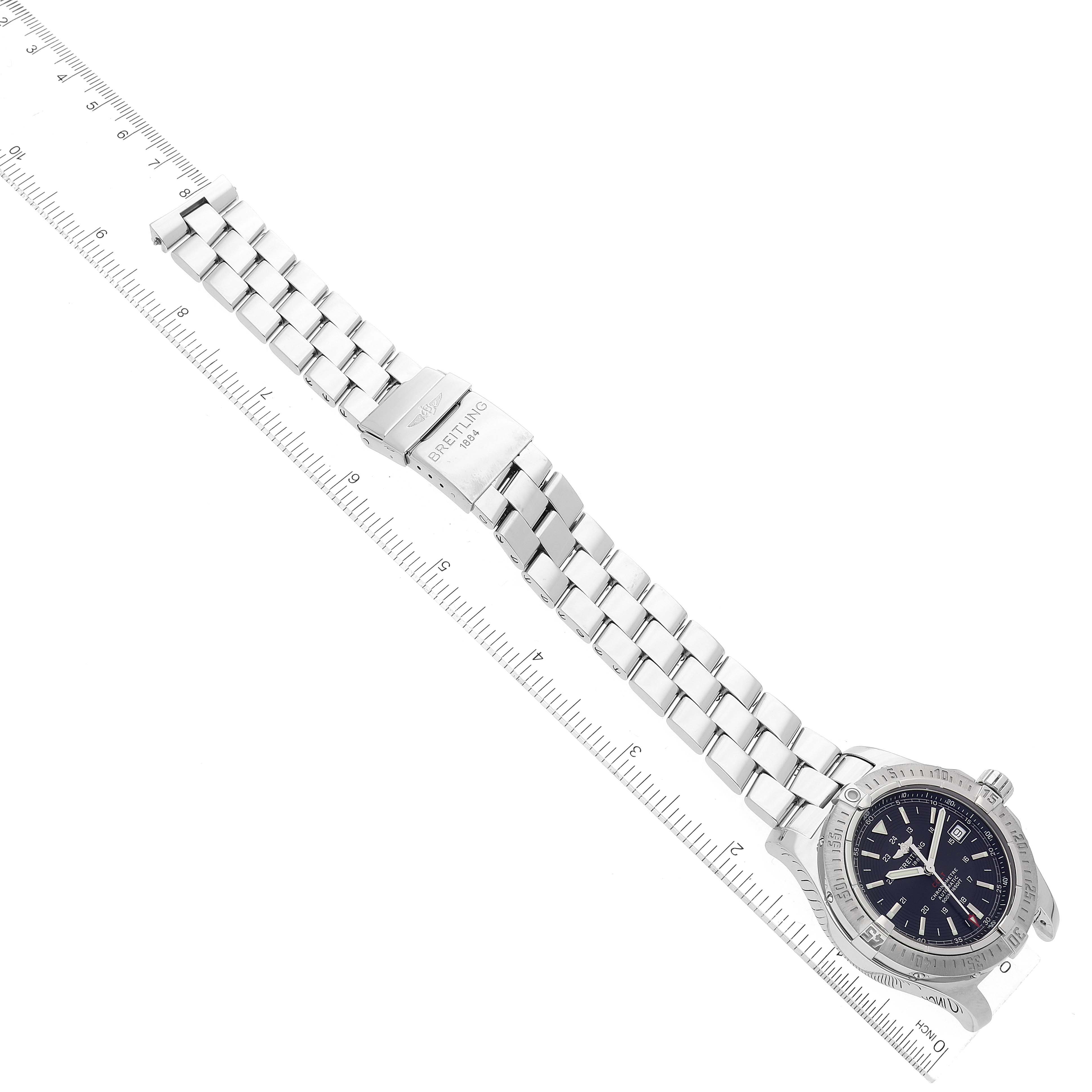 The Colt model by Breitling is shown from a top view, displaying the watch face, bezel, and metal bracelet with clasp.