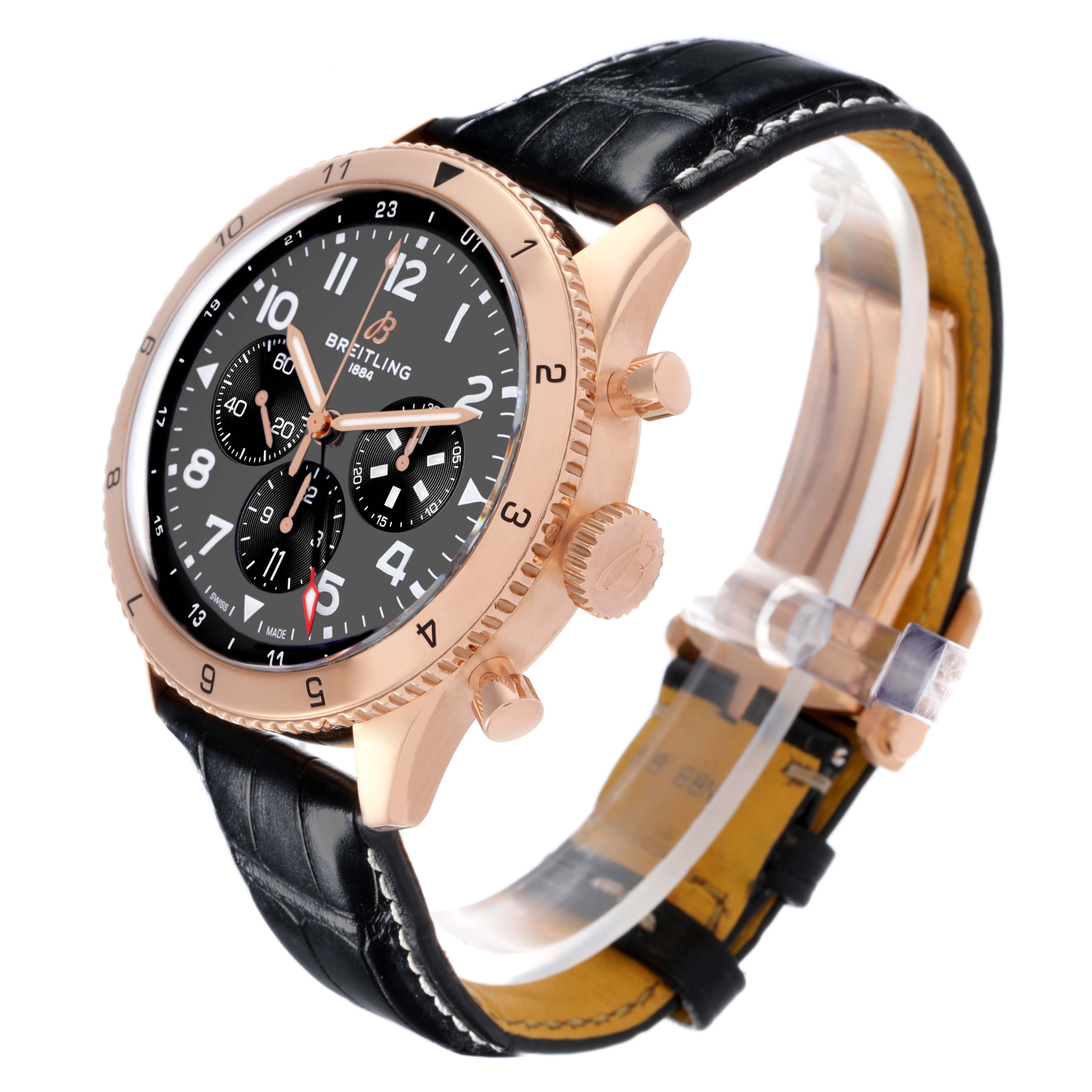 The Breitling Aviator RB04451A1B1X1 Men's Rose Gold Grey Dial RB04451A1B1X1 Men's Rose Gold Grey Dial watch is shown at an angle highlighting the face, bezel, crown, and leather strap.