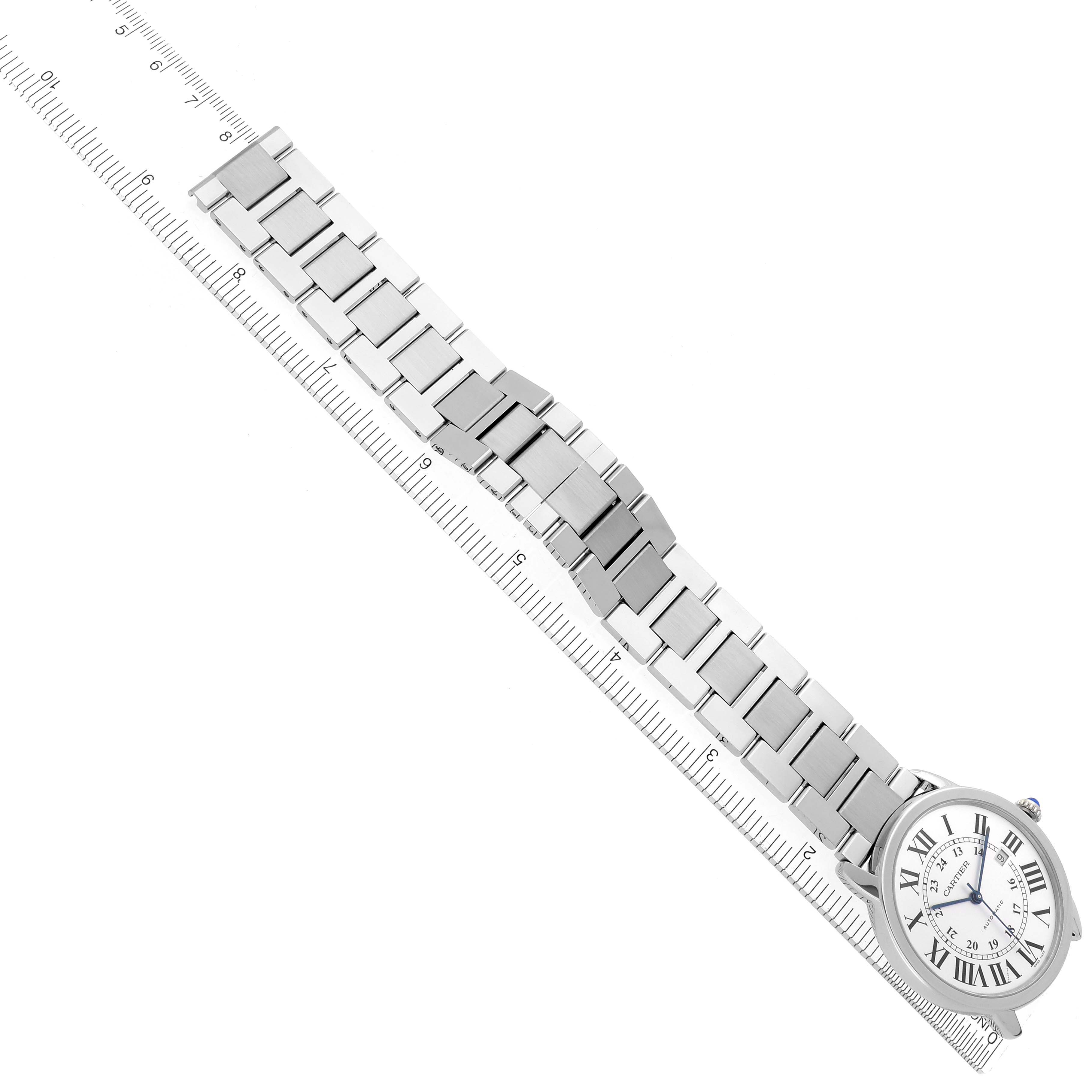 The Ronde model by Cartier is shown from a top-down angle, displaying the watch face and entire metal bracelet.