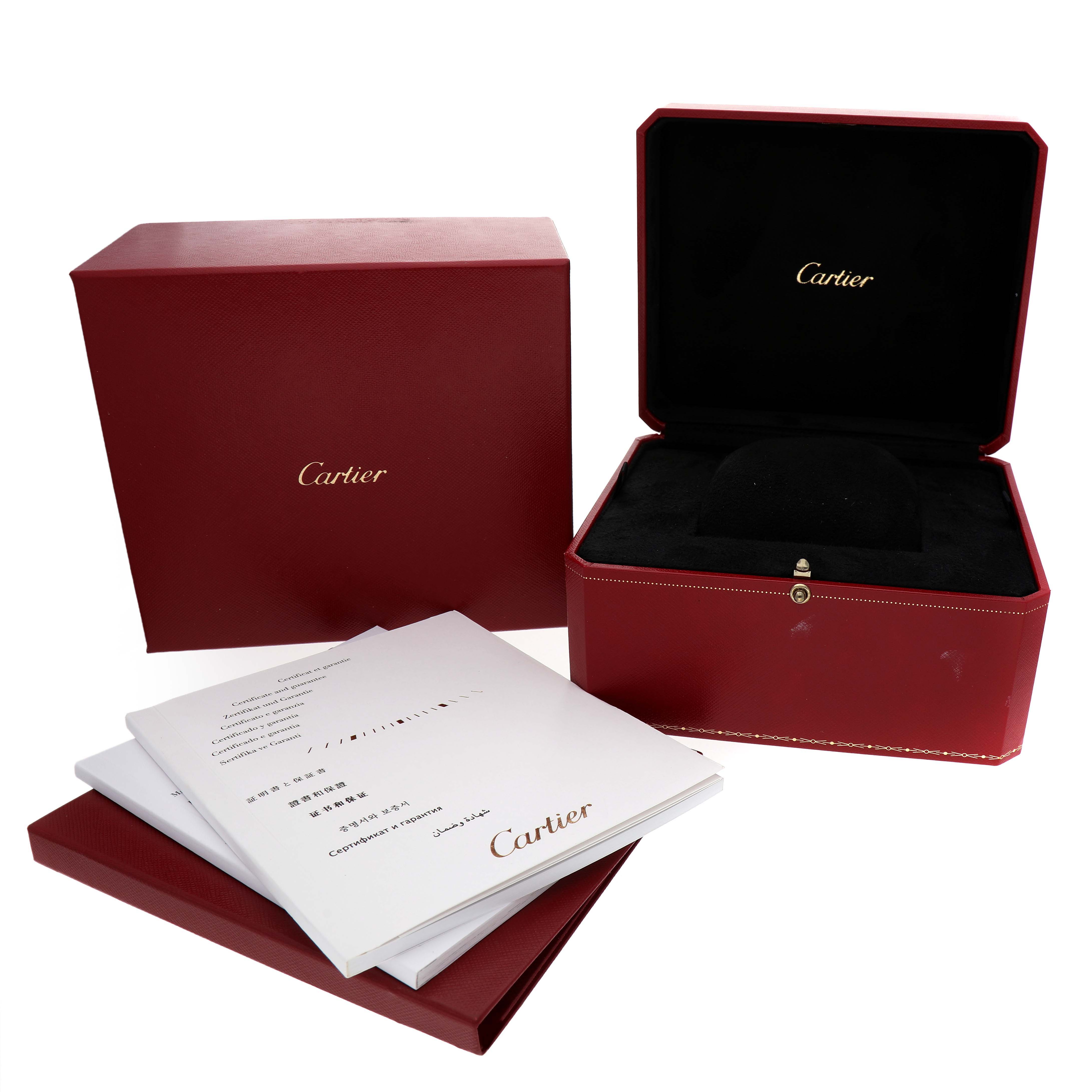 The image shows the packaging and manuals for a Cartier Santos Dumont WH100651 Men's Rose Gold Silver Dial watch, featuring the box and papers.