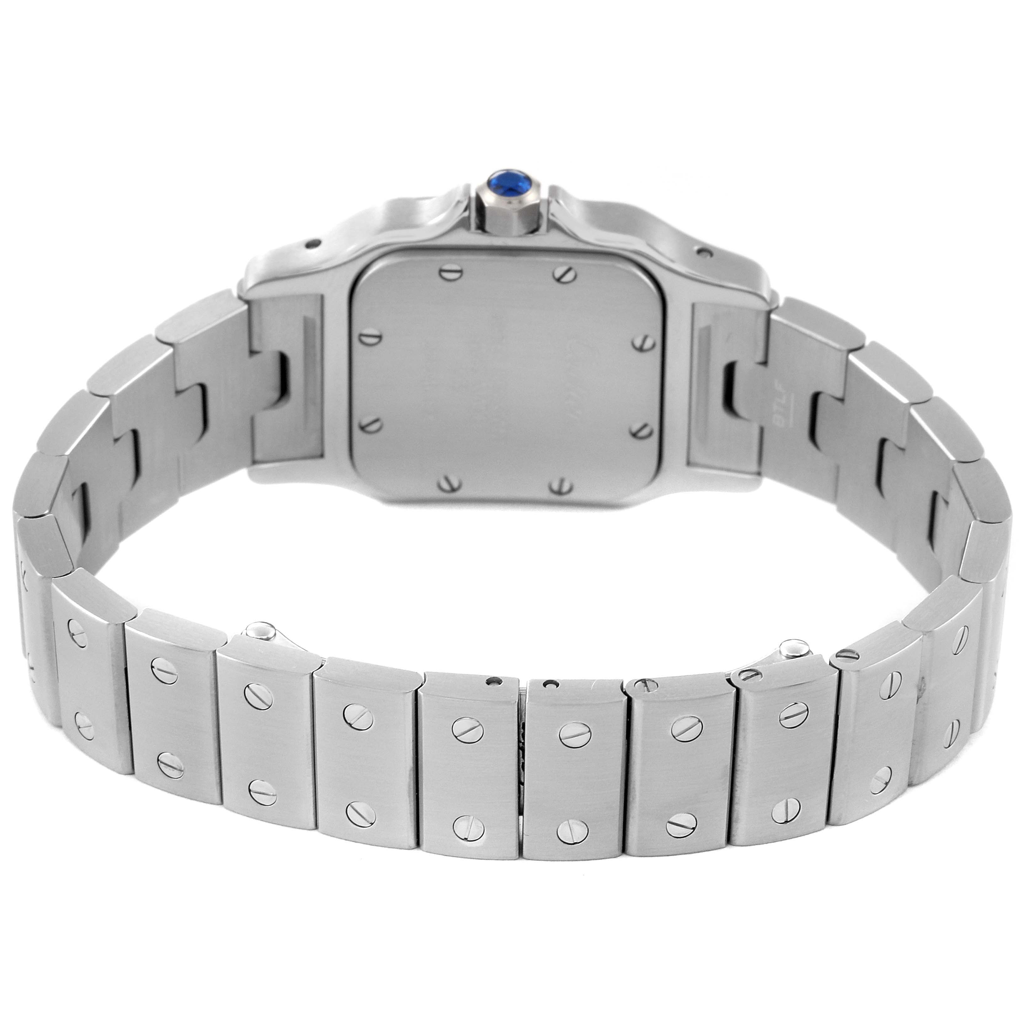 This image shows the back of the Cartier Santos W20056D6 Women's Stainless Steel Silver Dial W20056D6 Women's Stainless Steel Silver Dial watch and its stainless steel bracelet.