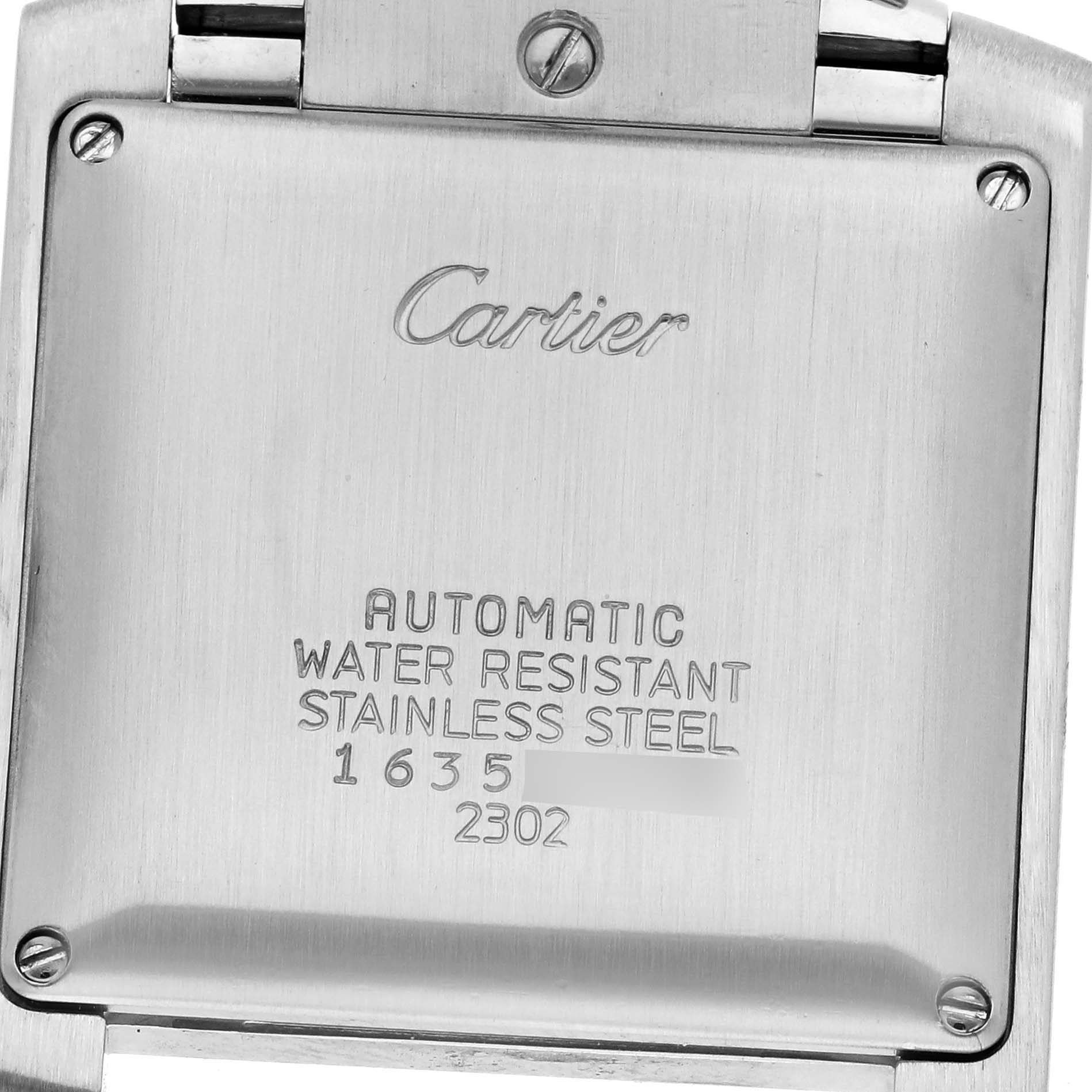 The image shows the back case of the Cartier Tank Française watch, displaying engravings with technical details.