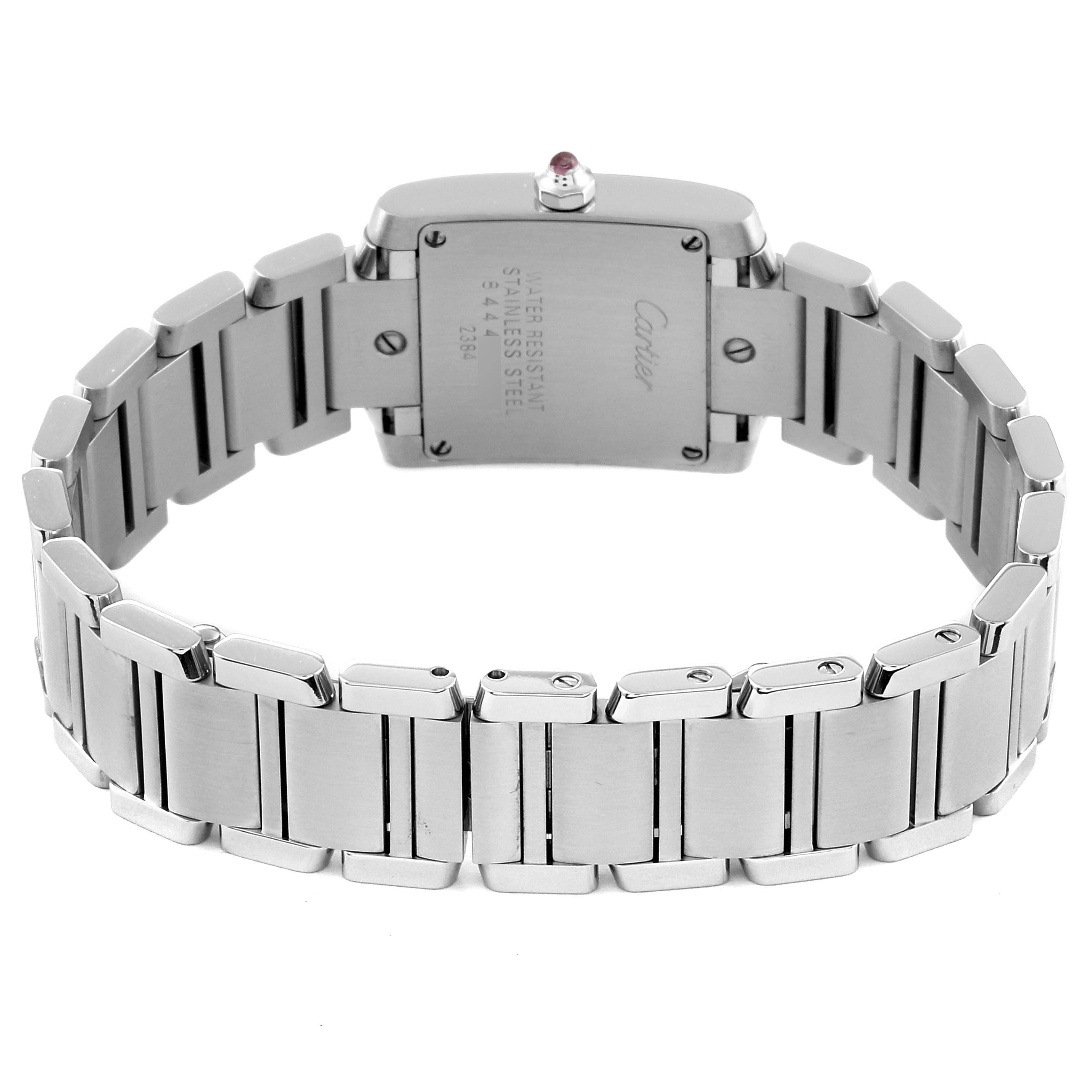 The image shows the back view of a Cartier Tank Française watch, highlighting its stainless steel bracelet and case back.