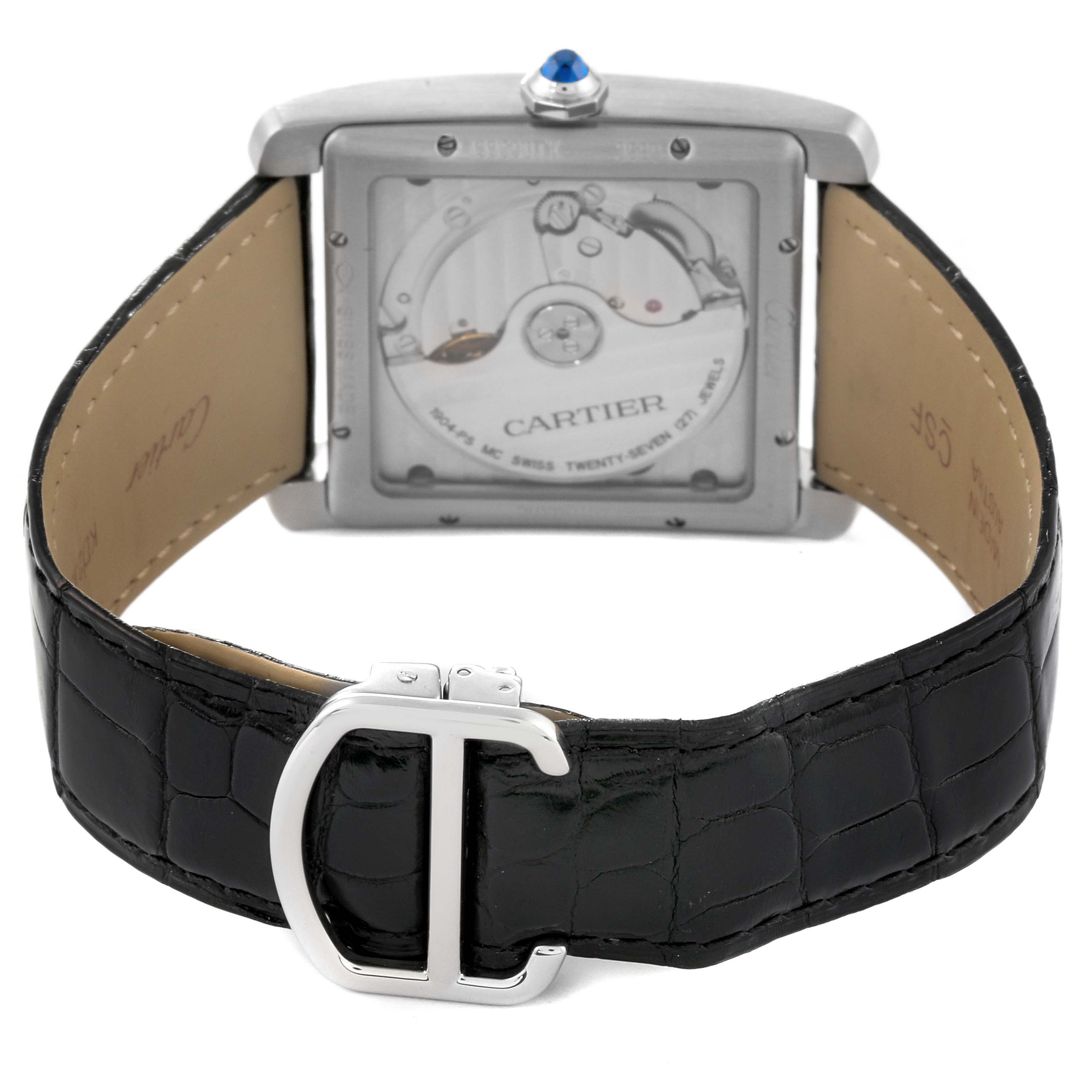 The image shows the back view of a Cartier Tank MC W5330004 Men
s Stainless Steel Black Dial W5330004 Men
s Stainless Steel Black Dial watch, highlighting its transparent case back and black leather strap with a deployant clasp.