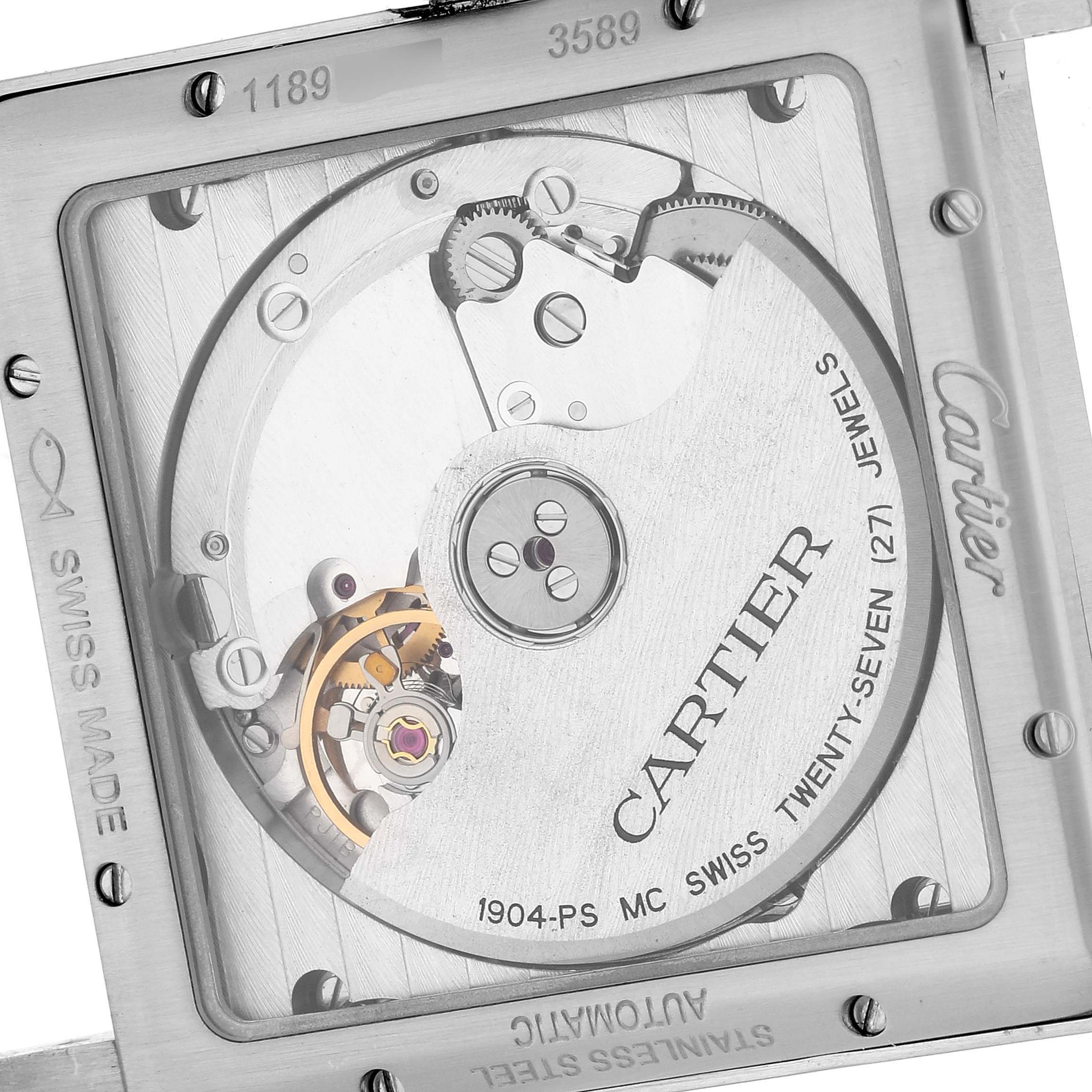 The image shows the back of a Cartier Tank MC W5330003 Men
s Stainless Steel Silver Dial W5330003 Men
s Stainless Steel Silver Dial watch, highlighting its automatic movement mechanics and engravings.