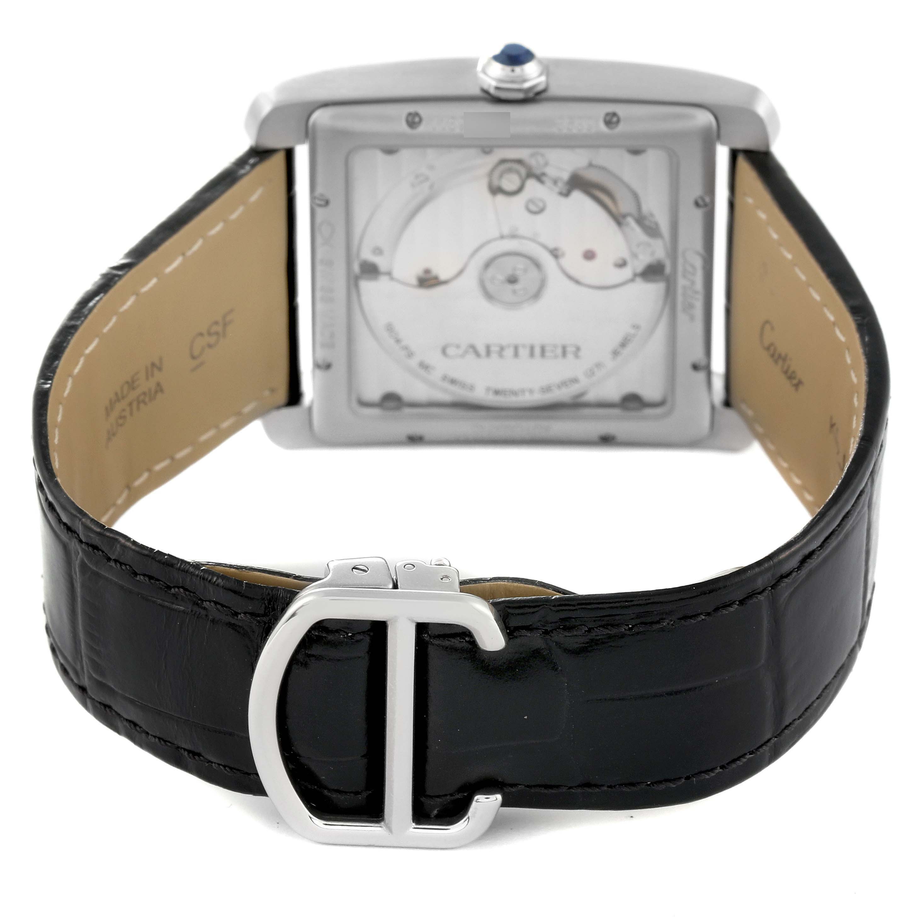 This image shows the back view of a Cartier Tank MC W5330003 Men
s Stainless Steel Silver Dial W5330003 Men
s Stainless Steel Silver Dial watch, featuring the movement and leather strap with buckle.