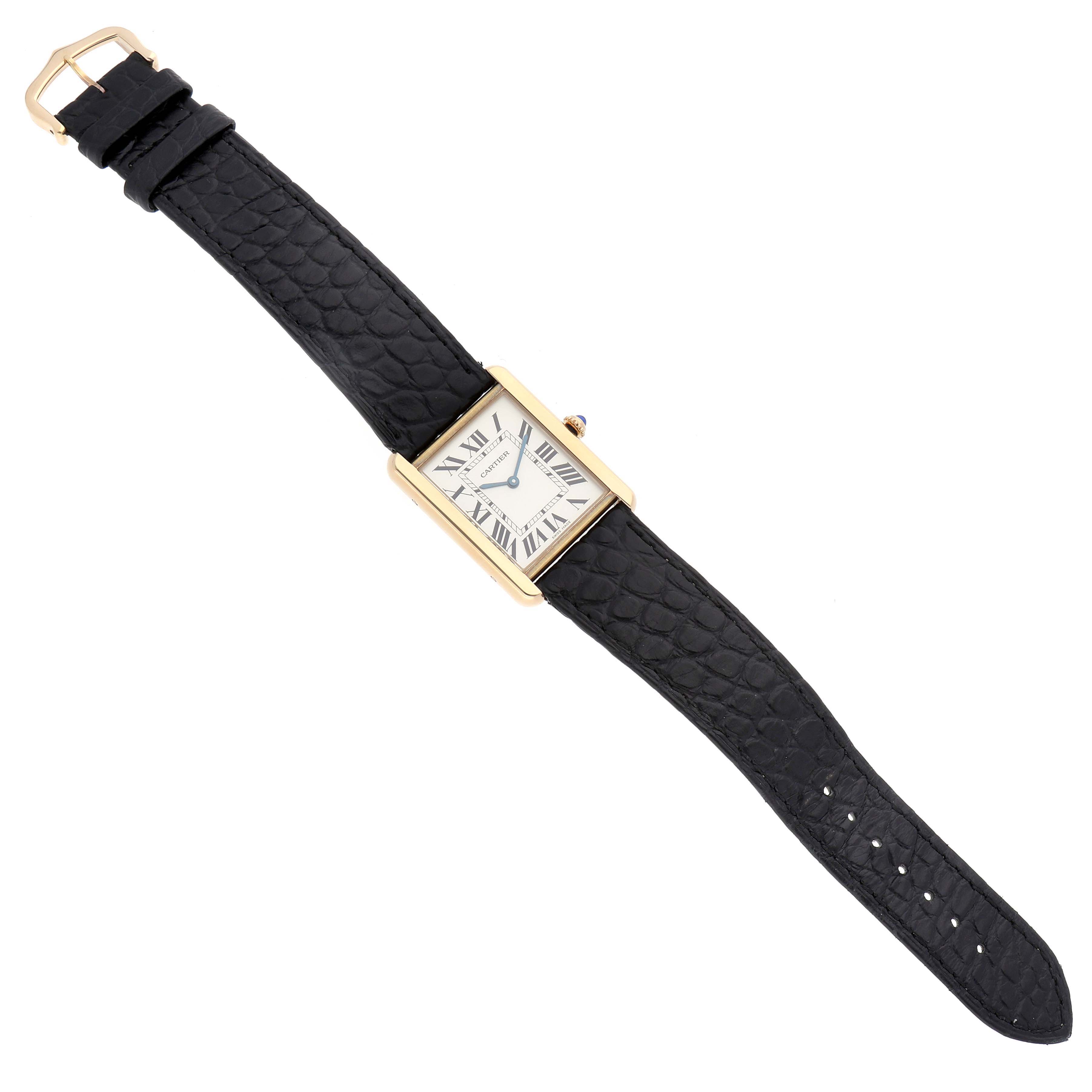 The Cartier Tank Solo W5200004 Men's Steel and Gold (two tone) Silver Dial W5200004 Men's Steel and Gold (two tone) Silver Dial watch is shown from a top-down angle, highlighting its rectangular case and black leather strap.