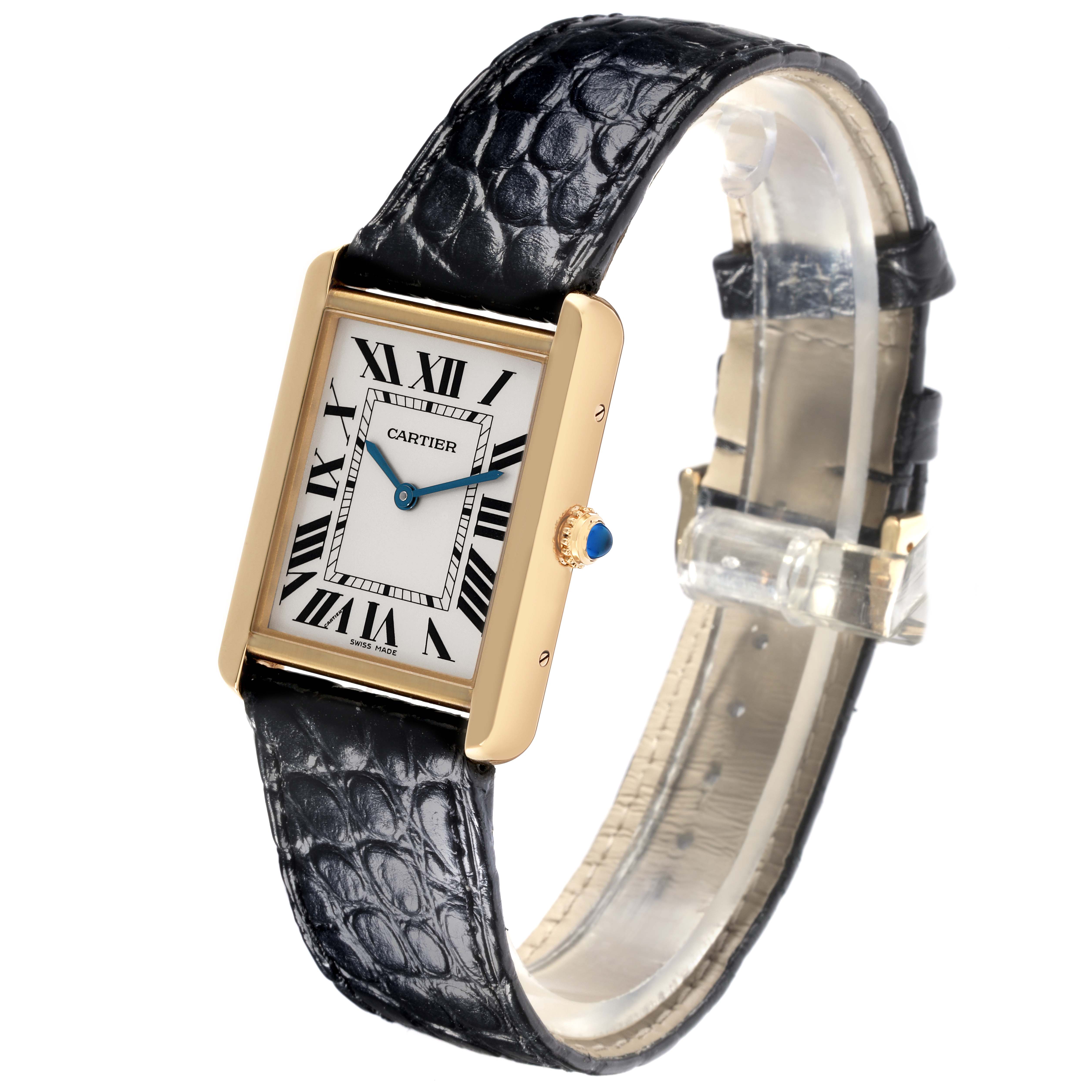 The Cartier Tank Solo W5200004 Men's Steel and Gold (two tone) Silver Dial W5200004 Men's Steel and Gold (two tone) Silver Dial watch is shown at an angle displaying its rectangular face, alligator leather strap, and crown with a blue gemstone.