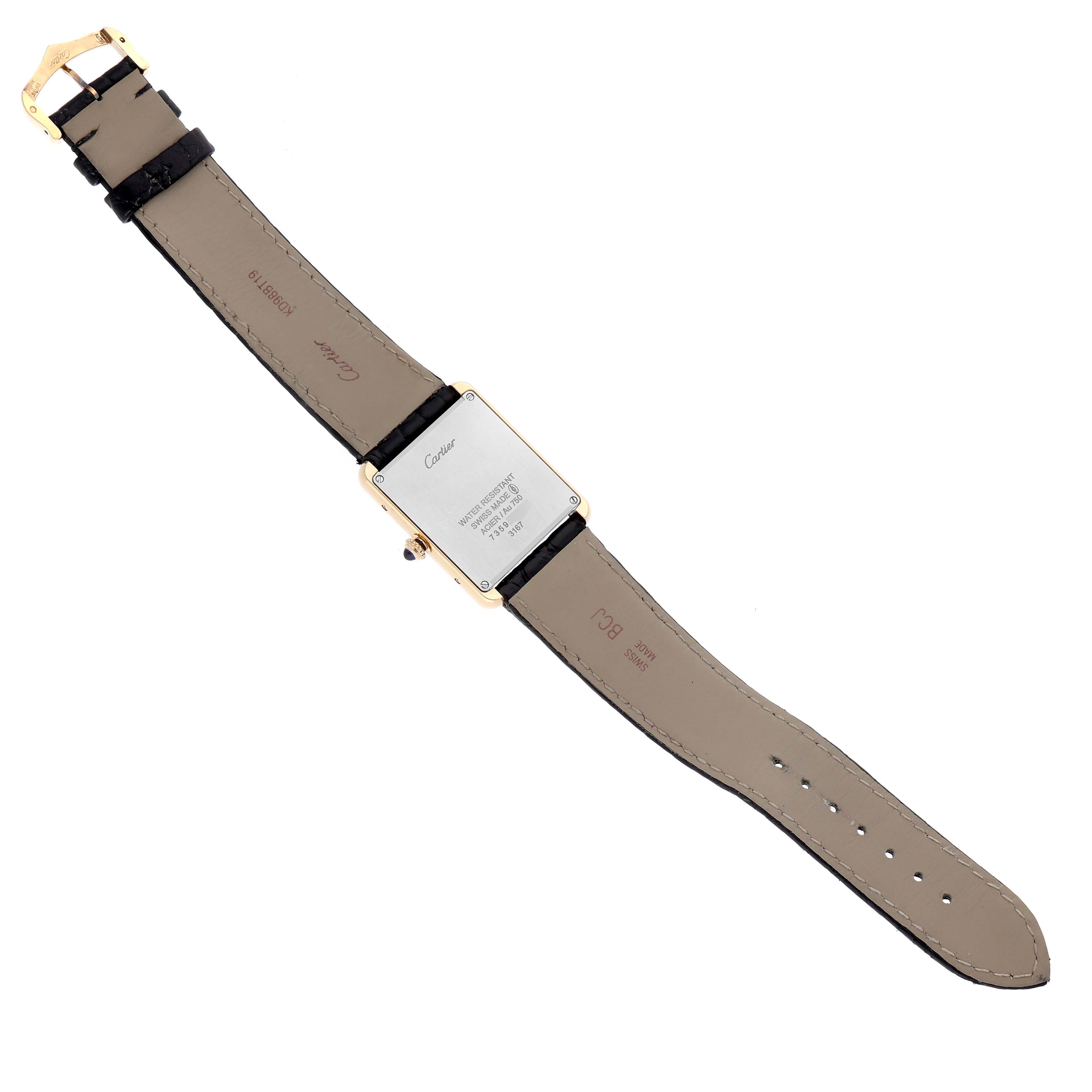 The image shows the back view of the Cartier Tank Solo W5200004 Men's Steel and Gold (two tone) Silver Dial W5200004 Men's Steel and Gold (two tone) Silver Dial watch, featuring the case back and leather strap.