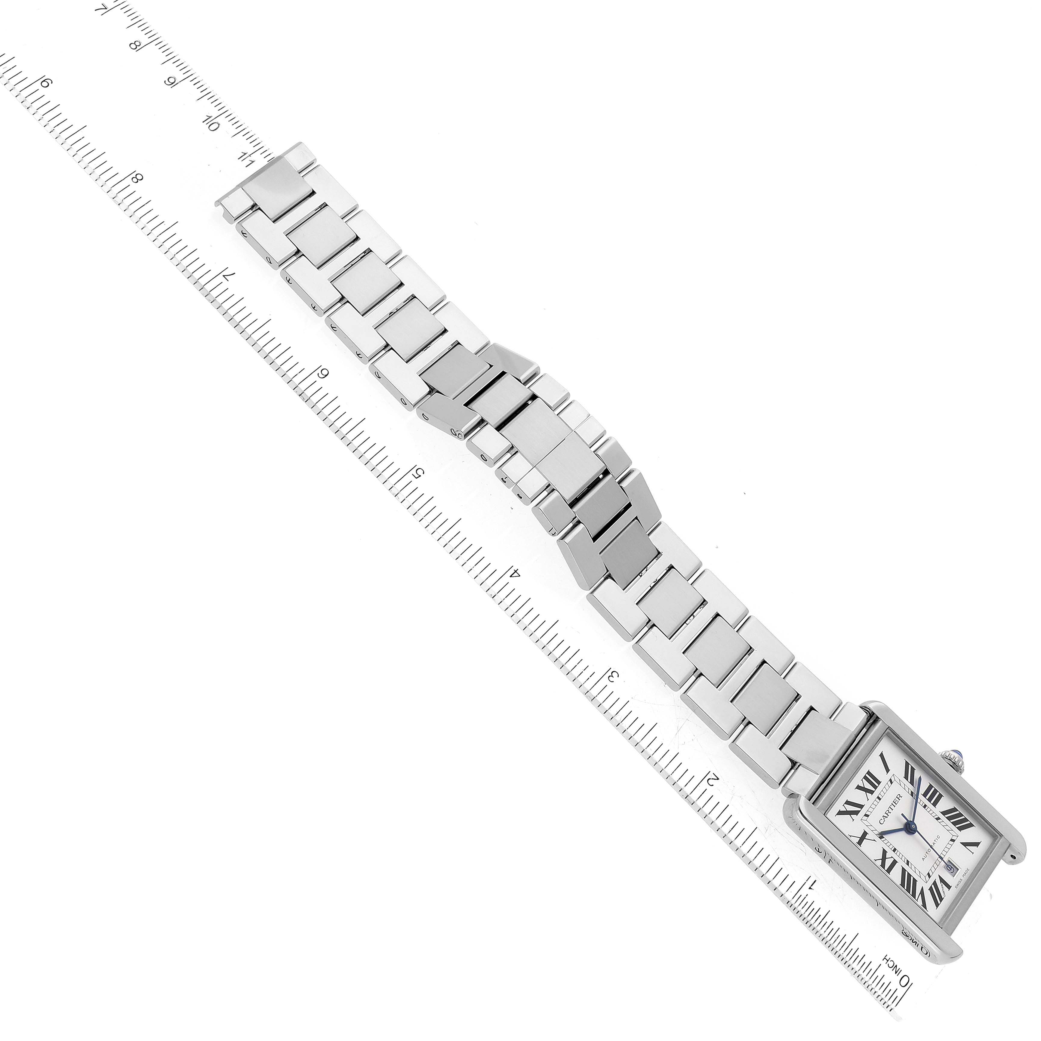 The image shows a top-down view of a Cartier Tank Solo W5200028 Men
s Stainless Steel Silver Dial W5200028 Men
s Stainless Steel Silver Dial watch fully extended beside a ruler.