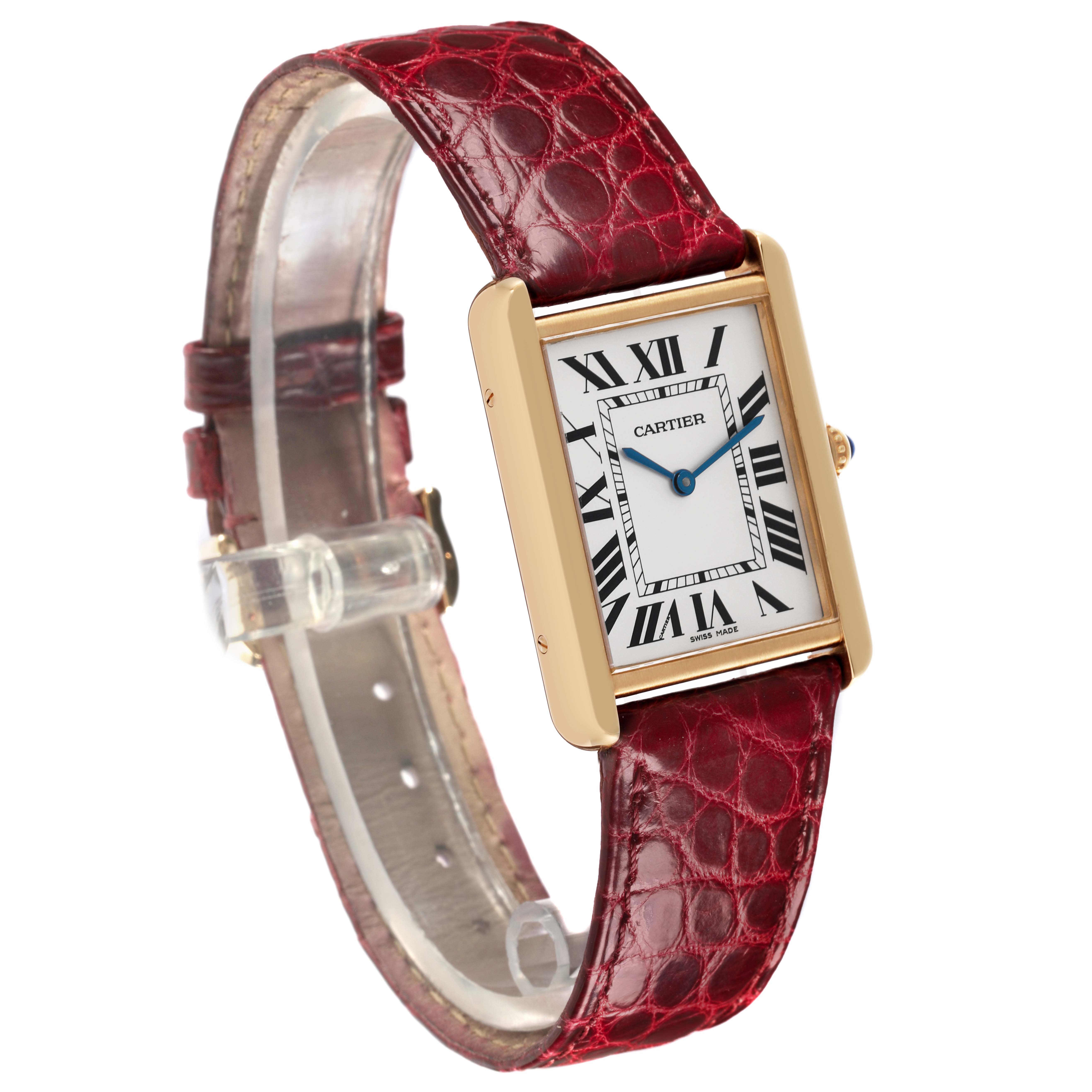 The Cartier Tank Solo W1018855 Men's Steel and Gold (two tone) Silver Dial W1018855 Men's Steel and Gold (two tone) Silver Dial watch is shown at a slight angle, highlighting the rectangular case, dial, and red leather strap.
