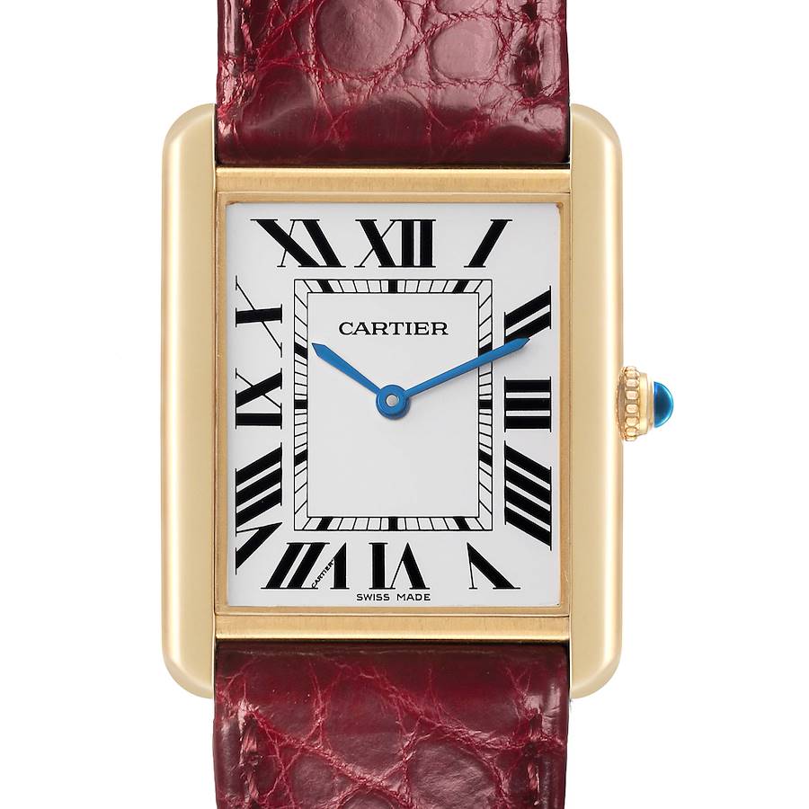 The Cartier Tank Solo watch is shown from the front, displaying the dial, case, Roman numerals, blue hands, and crown with a red leather strap.