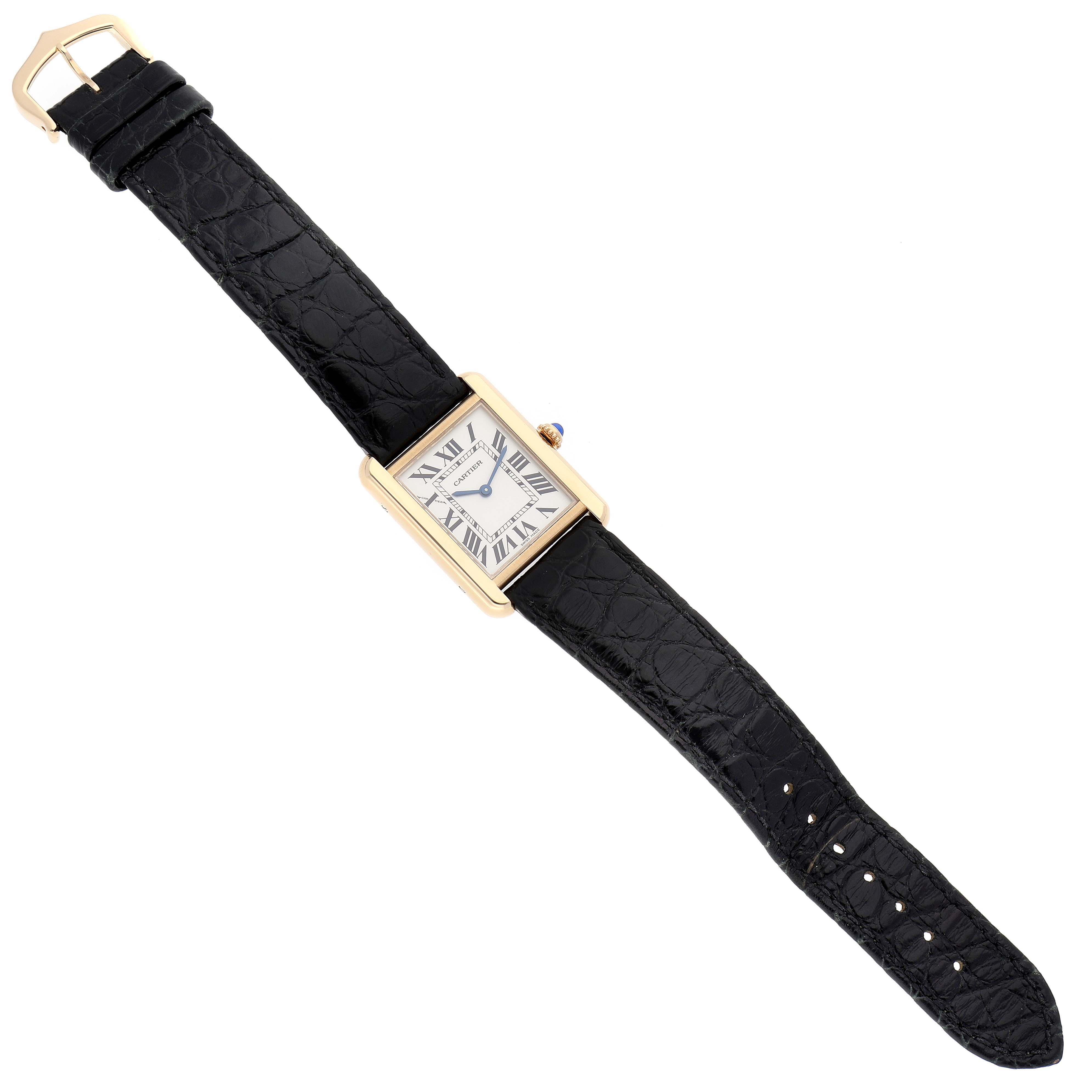 This image shows a top-down view of the Cartier Tank Solo W5200002 Women
s Steel and Gold (two tone) Silver Dial W5200002 Women
s Steel and Gold (two tone) Silver Dial watch, showcasing its black leather strap and rectangular face.