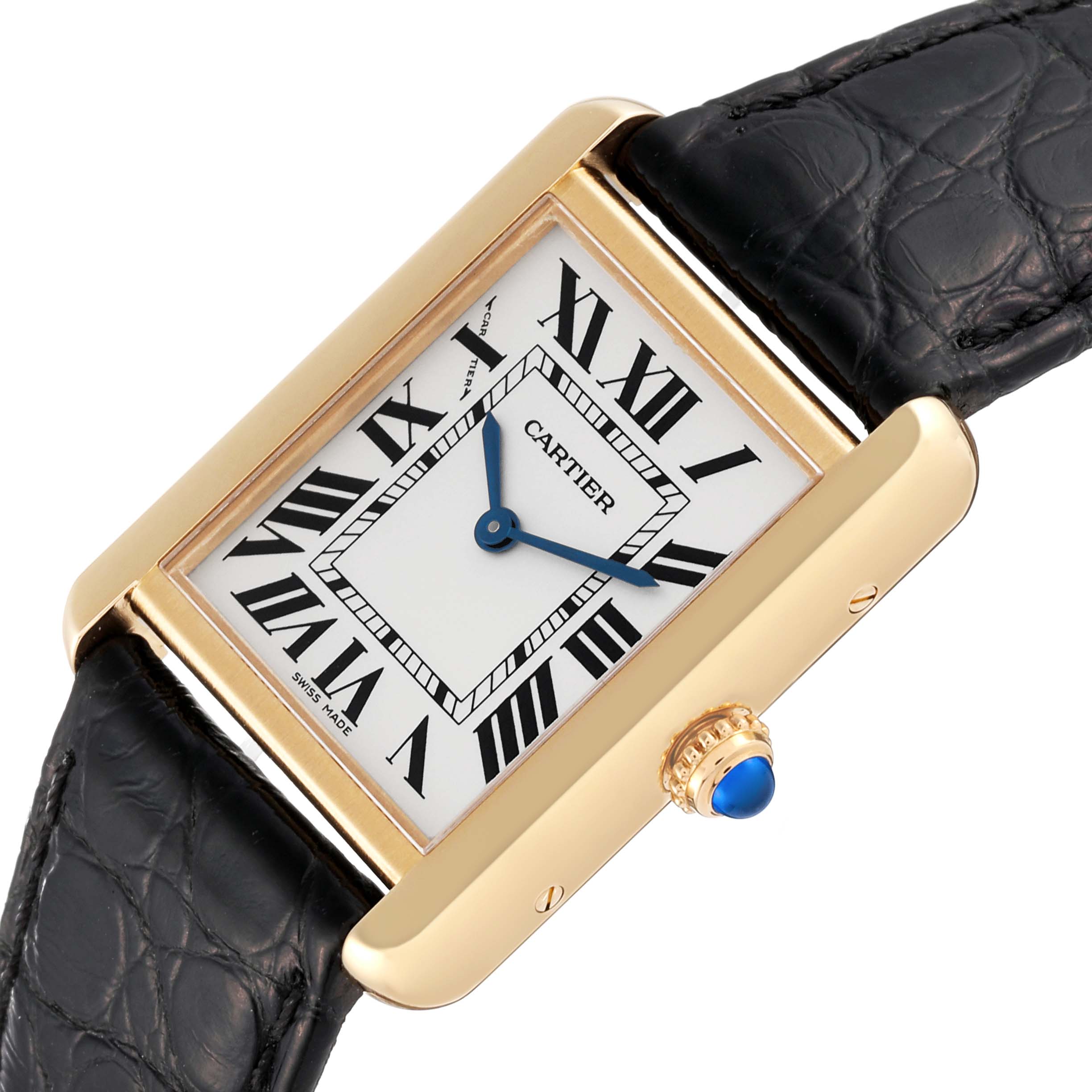 The Cartier Tank Solo W5200002 Women
s Steel and Gold (two tone) Silver Dial W5200002 Women
s Steel and Gold (two tone) Silver Dial watch is shown from an angled side view, displaying its rectangular face, black leather strap, and gold casing with a blue crown.