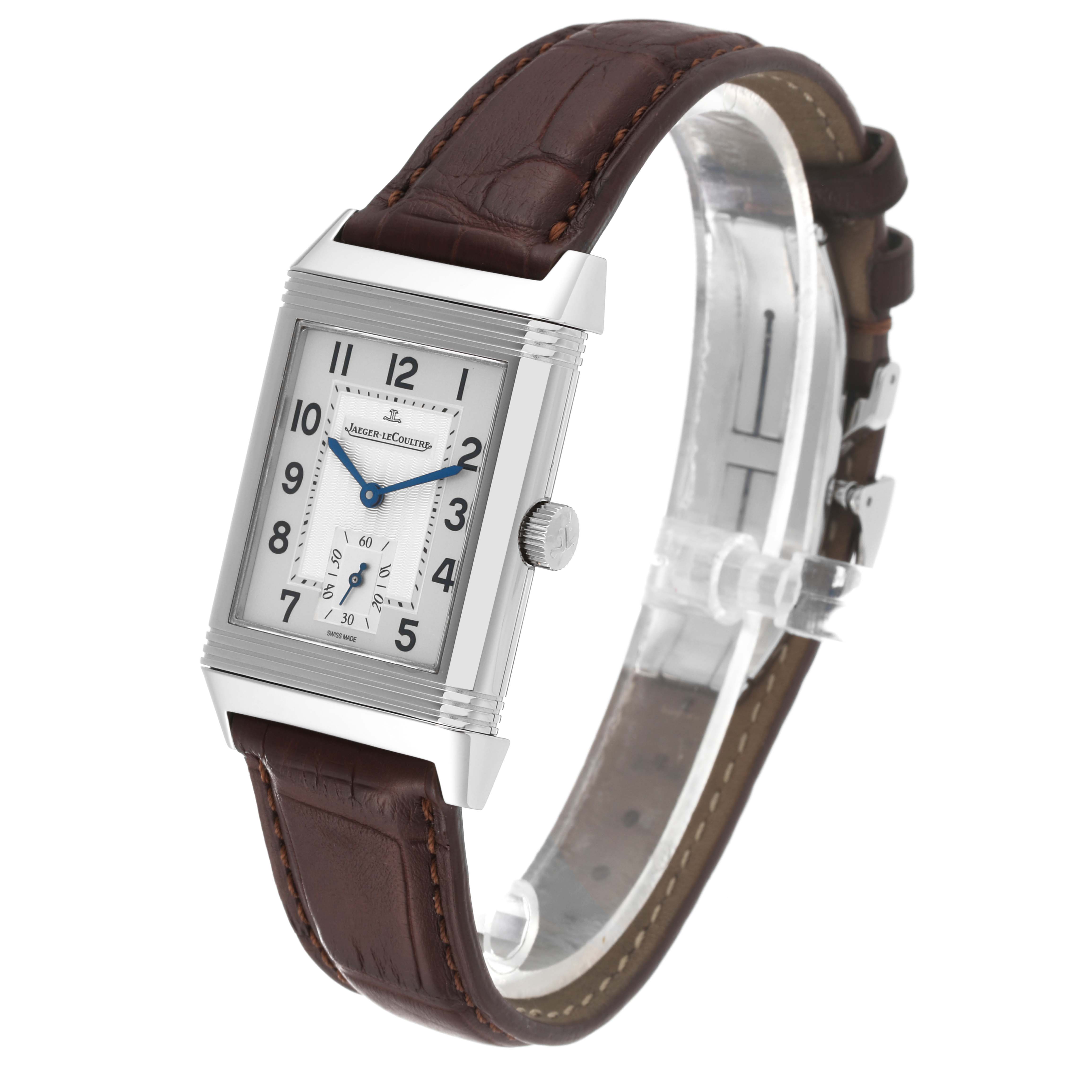 The Jaeger LeCoultre Reverso Q3858520 Men's Stainless Steel Silver Dial Q3858520 Men's Stainless Steel Silver Dial watch is shown at a three-quarter angle, displaying its rectangular face, crown, and brown leather strap.