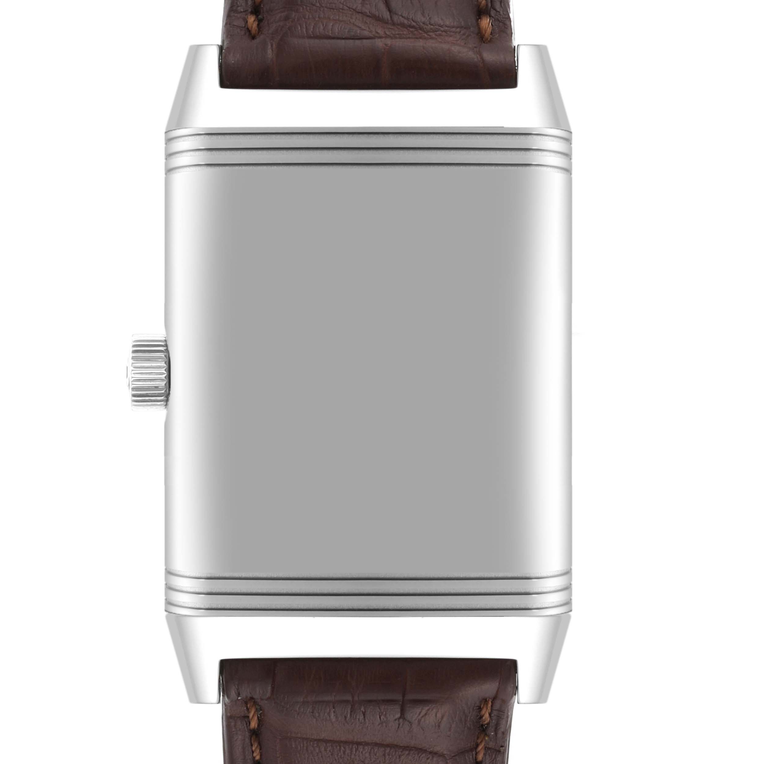 The image shows a front view of the Jaeger-LeCoultre Reverso model, highlighting its case and crown, with a partial leather strap.