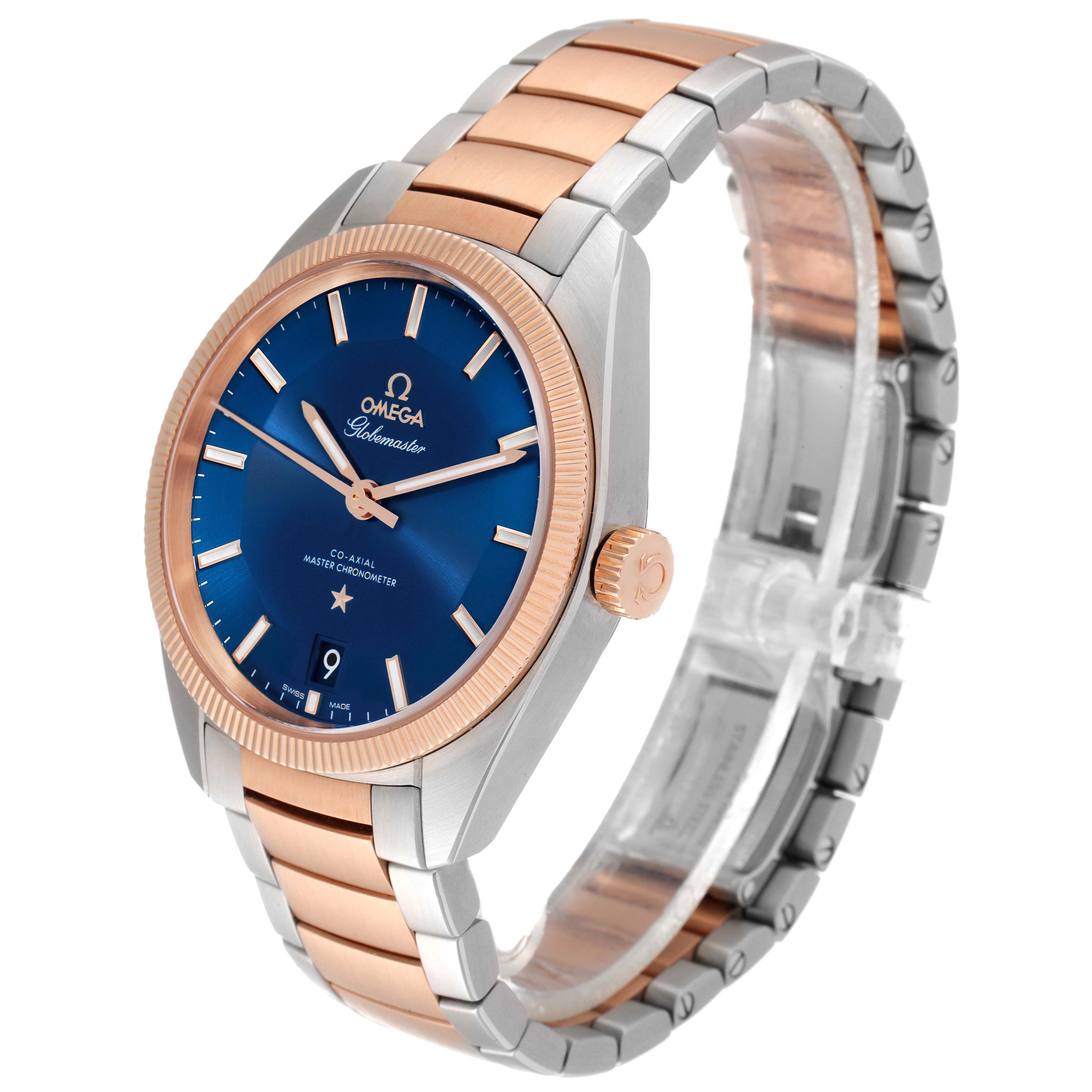 The image shows a front-side angle of the Omega Constellation 130.20.39.21.03.001 Men's Steel and Gold (two tone) Blue Dial 130.20.39.21.03.001 Men's Steel and Gold (two tone) Blue Dial watch, highlighting its blue dial and two-tone bracelet.