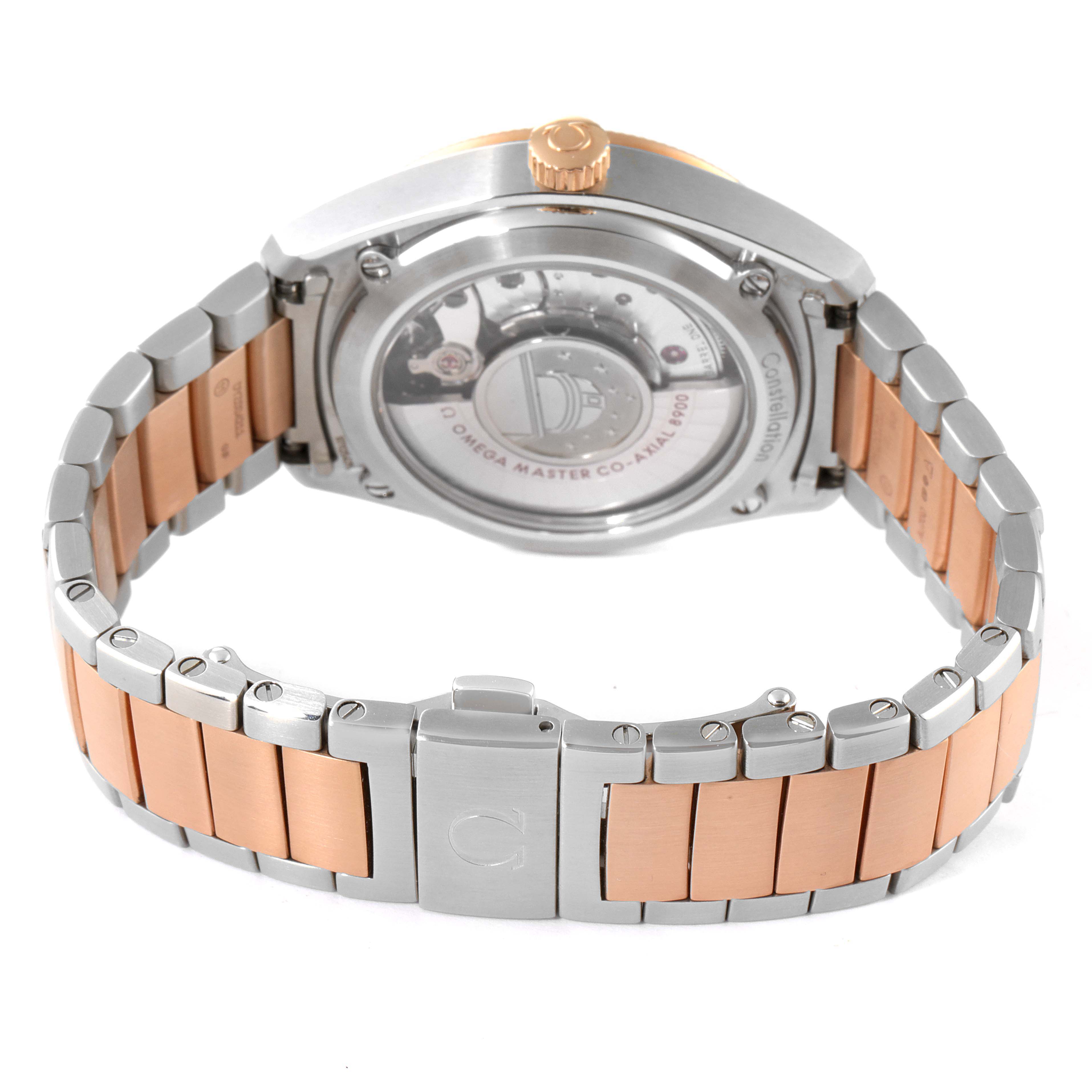 The image shows the back view of an Omega Constellation 130.20.39.21.03.001 Men's Steel and Gold (two tone) Blue Dial 130.20.39.21.03.001 Men's Steel and Gold (two tone) Blue Dial watch, highlighting its case back, crown, and two-tone bracelet.