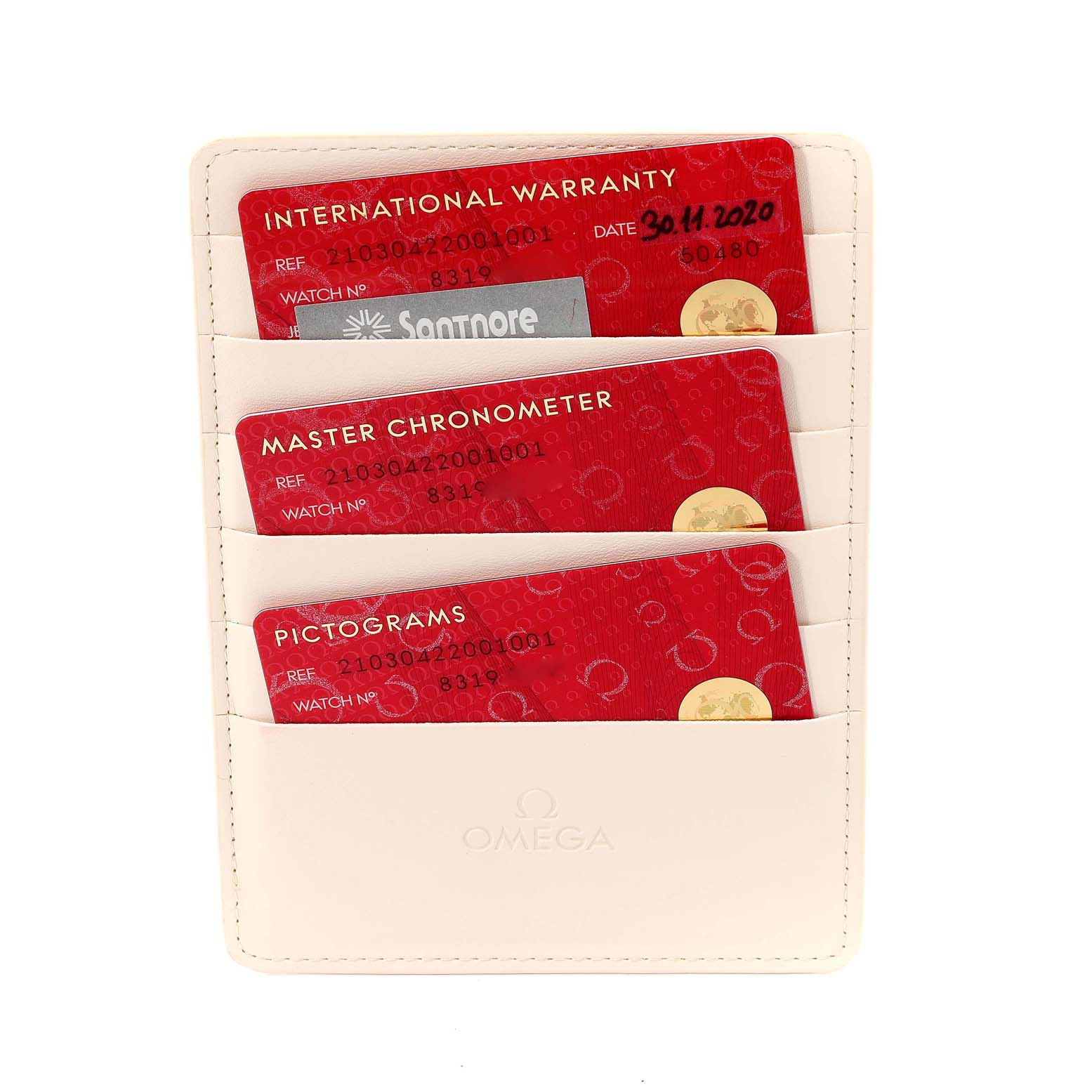 Shown at an overhead angle are the warranty, chronometer, and pictogram cards for an Omega Seamaster 210.30.42.20.01.001 Men
s Stainless Steel Black Dial 210.30.42.20.01.001 Men
s Stainless Steel Black Dial watch in a card holder.