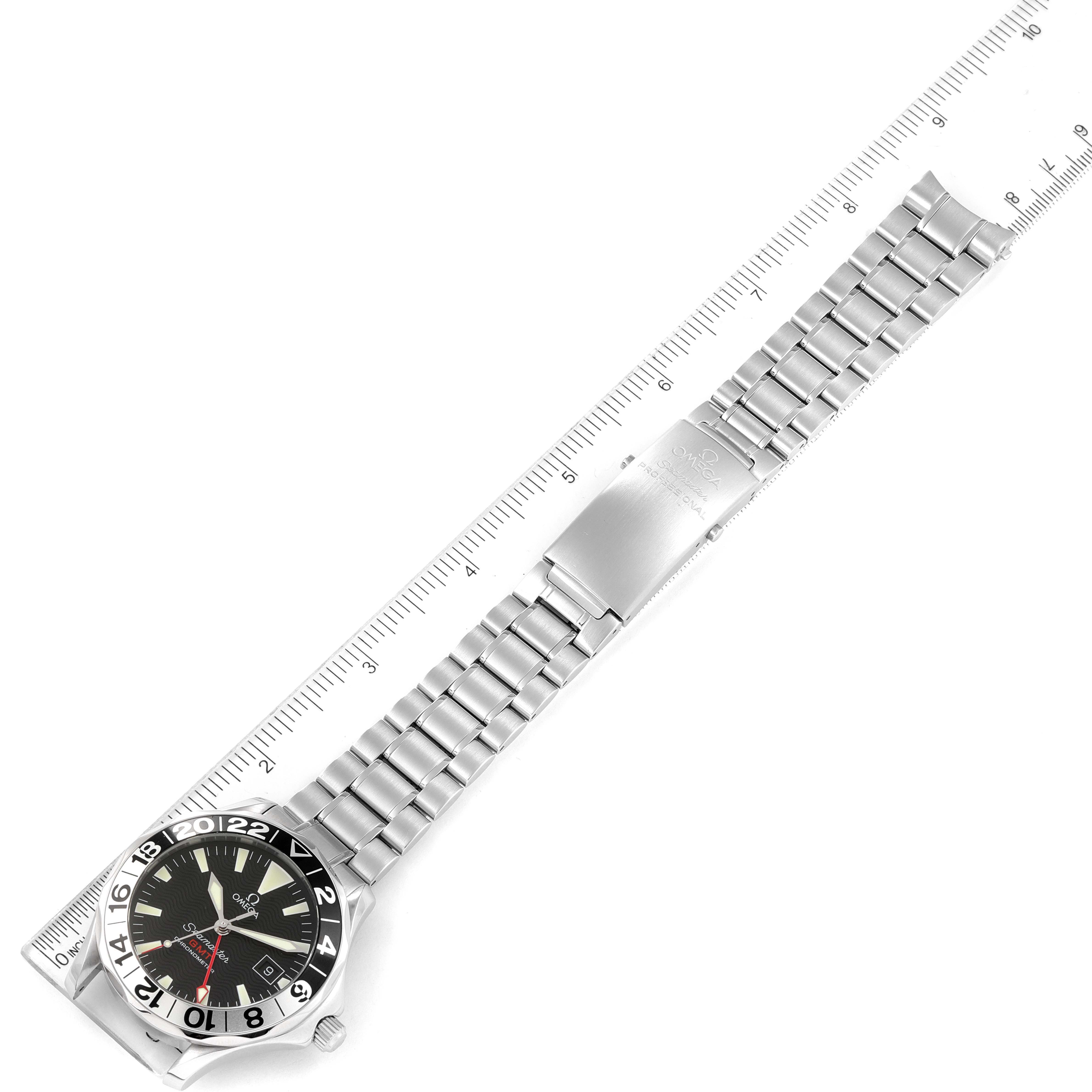 The image shows an Omega Seamaster 2234.50.00 Men's Stainless Steel Black Dial 2234.50.00 Men's Stainless Steel Black Dial watch positioned flat next to a ruler, displaying the full length of the bracelet and the watch face.