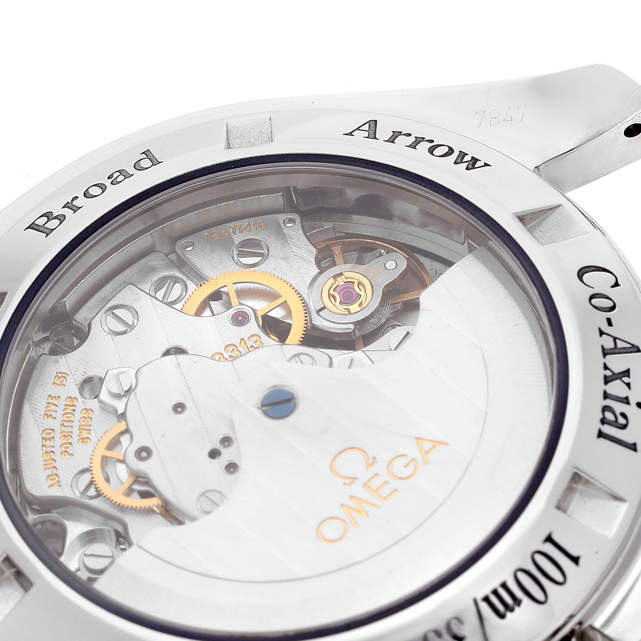 The image shows a close-up view of the back of the Omega Speedmaster 321.10.42.50.01.001 Men
s Stainless Steel Black Dial 321.10.42.50.01.001 Men
s Stainless Steel Black Dial Broad Arrow Co-Axial watch, highlighting its mechanical movement.