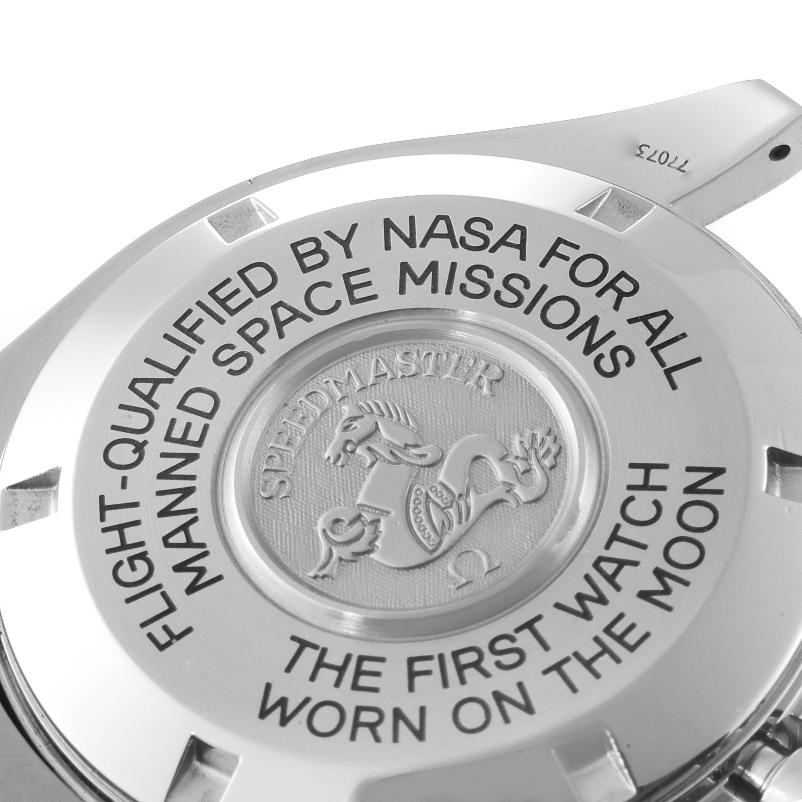 The image shows the back case of the Omega Speedmaster 3575.30.00 Men
s Stainless Steel Silver Dial 3575.30.00 Men
s Stainless Steel Silver Dial watch, highlighting its NASA qualification and lunar history.