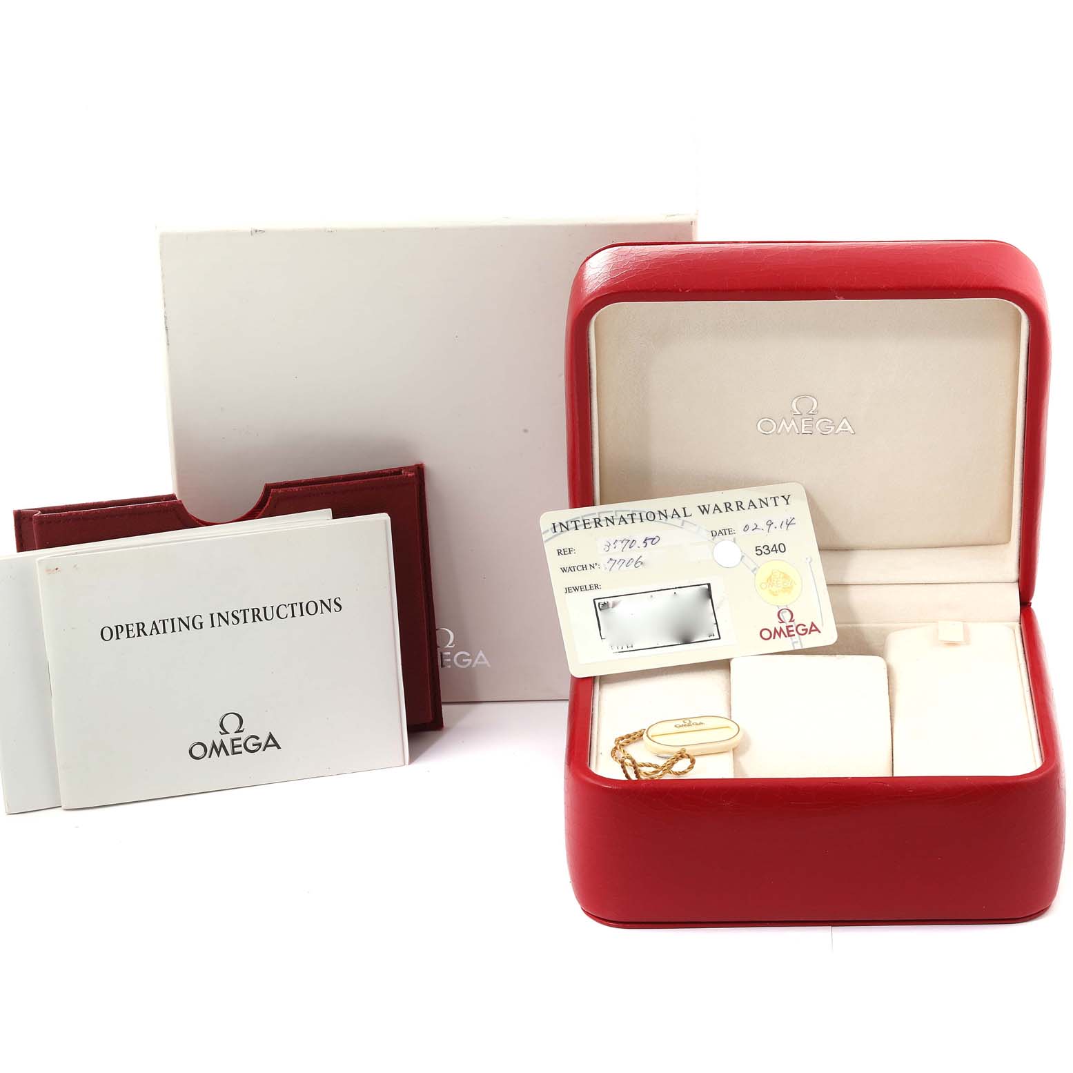 The image shows a red Omega Speedmaster 3570.50.00 Men
s Stainless Steel Black Dial 3570.50.00 Men
s Stainless Steel Black Dial watch box, international warranty card, and operating instructions booklet.