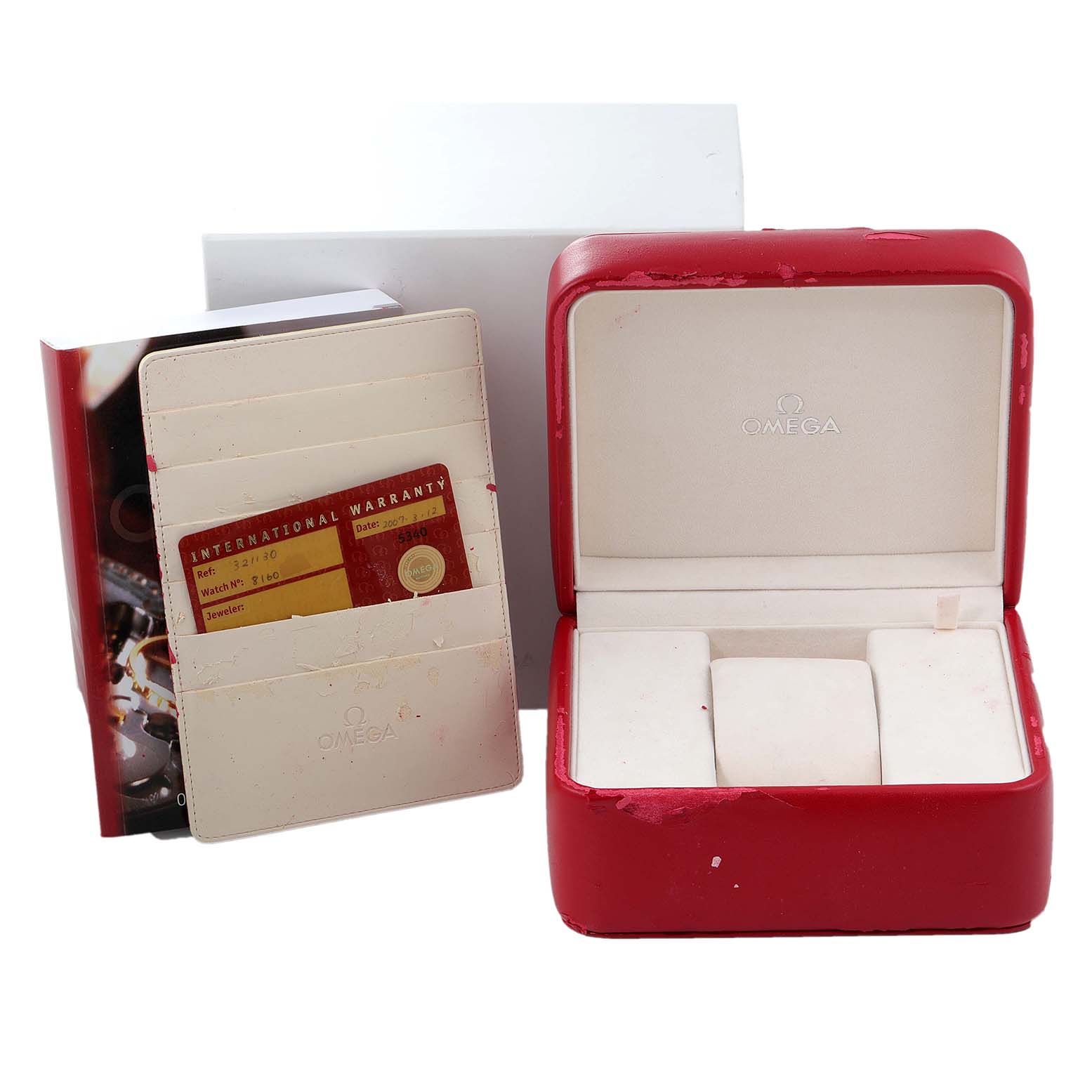 This image shows the packaging, international warranty card, and empty watch case for an Omega Speedmaster 3211.30.00 Men's Stainless Steel Silver Dial 3211.30.00 Men's Stainless Steel Silver Dial model.