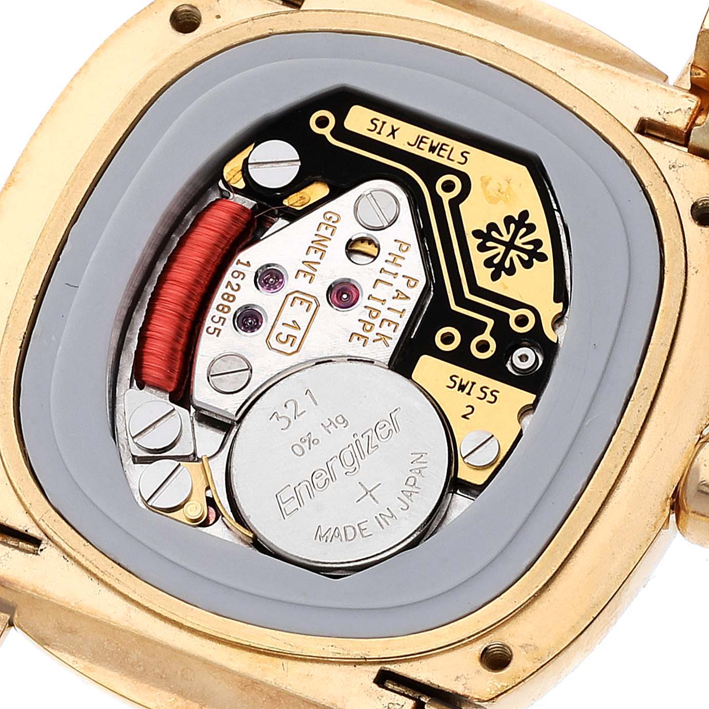 The image shows the back of the Patek Philippe Golden Ellipse 4830 Women's Yellow Gold White Dial 4830 Women's Yellow Gold White Dial watch, revealing its inner movement and battery.