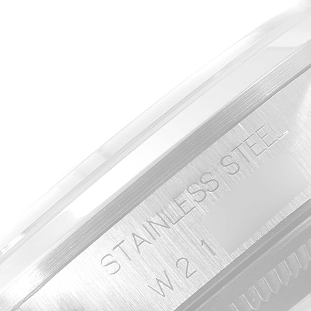 This close-up angle of the Rolex Air-King 14000 Men's Stainless Steel Blue Dial 14000 Men's Stainless Steel Blue Dial watch showcases the engraving "STAINLESS STEEL" on its case side.