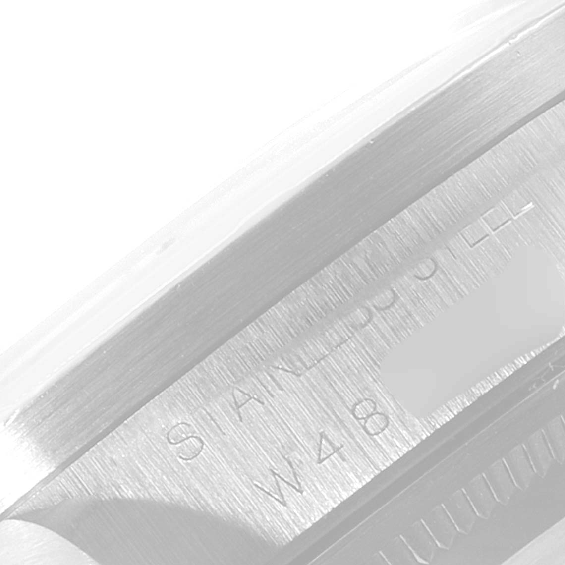 This image shows the case side engraving and serial number of a Rolex Air-King 14010 Men's Stainless Steel Blue Dial 14010 Men's Stainless Steel Blue Dial watch.