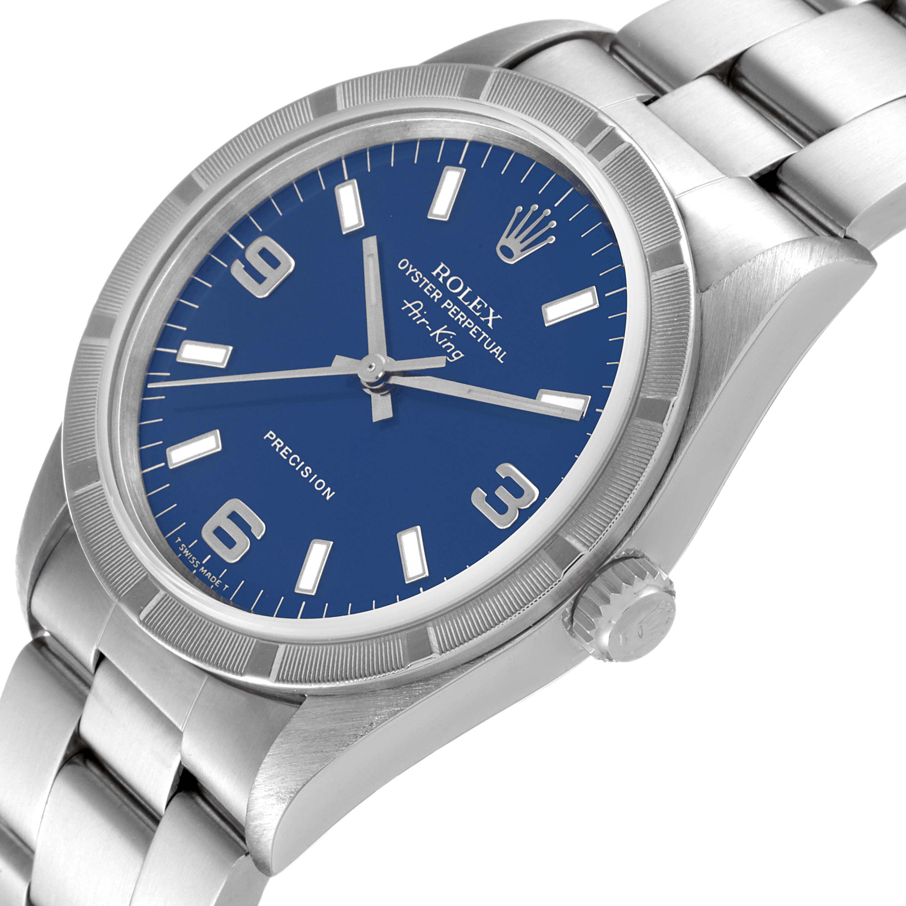 The Rolex Air-King 14010 Men's Stainless Steel Blue Dial 14010 Men's Stainless Steel Blue Dial watch is shown at an oblique angle, highlighting the dial, bezel, crown, and a portion of the bracelet.