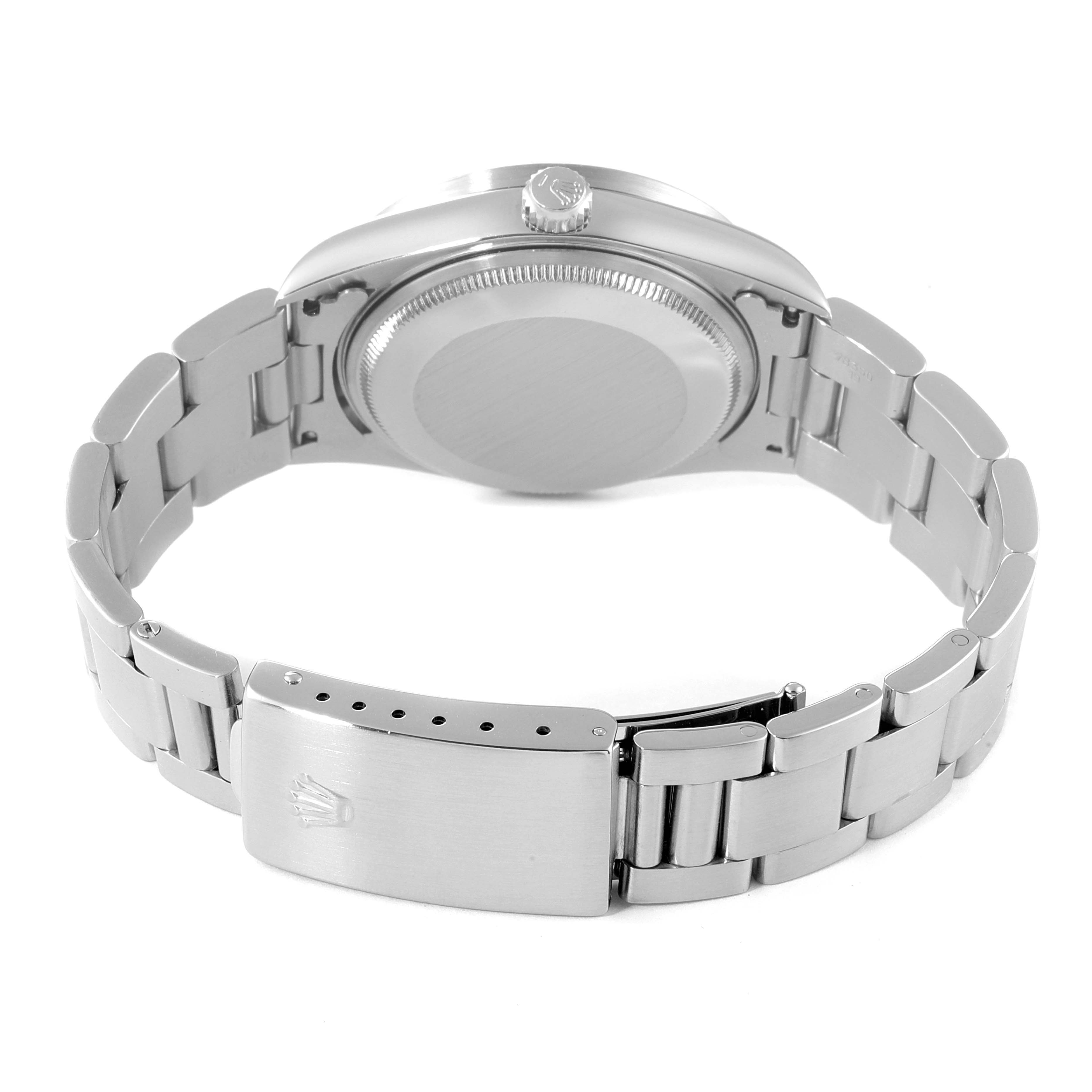 The Rolex Air-King 14010 Men's Stainless Steel Blue Dial 14010 Men's Stainless Steel Blue Dial watch is shown from a rear angle, featuring its case back and partially opened stainless steel bracelet.