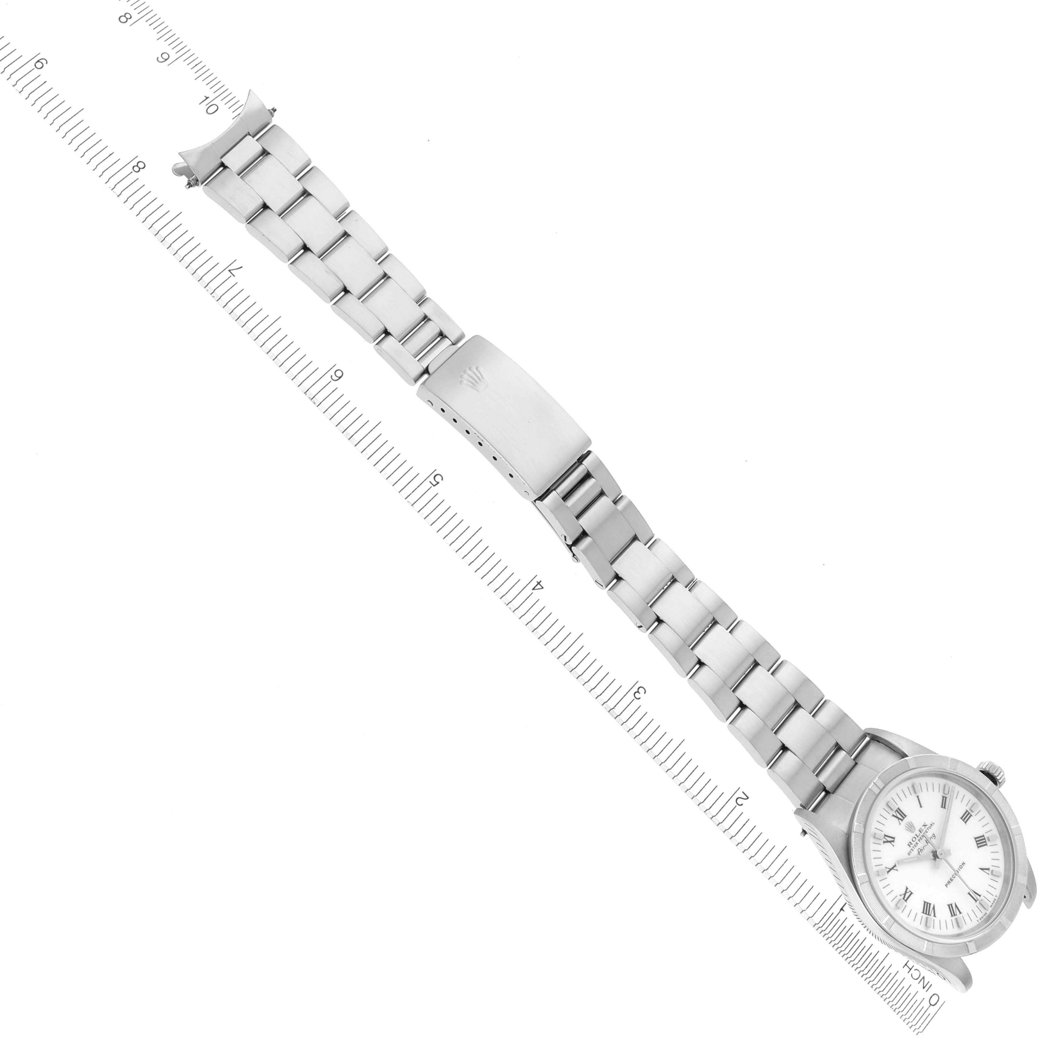 The image shows a top-down view of a Rolex Air-King 14010 Men's Stainless Steel White Dial 14010 Men's Stainless Steel White Dial watch with an extended metal bracelet alongside a ruler for scale.