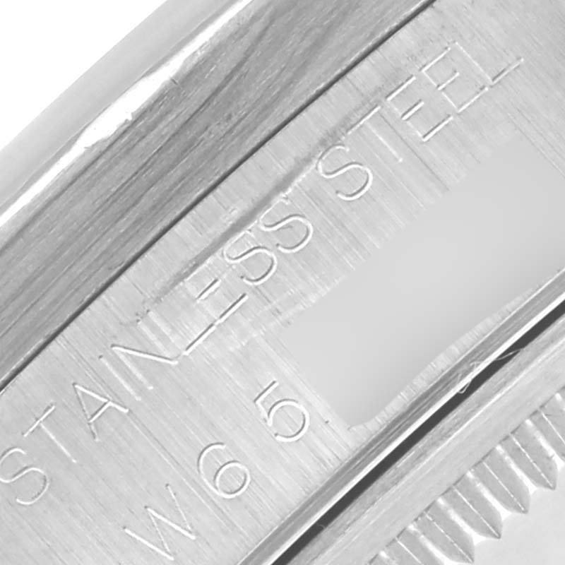 The image shows a close-up of the engraved side of a Rolex Air-King 14010 Men's Stainless Steel White Dial 14010 Men's Stainless Steel White Dial watch, highlighting "STAINLESS STEEL."